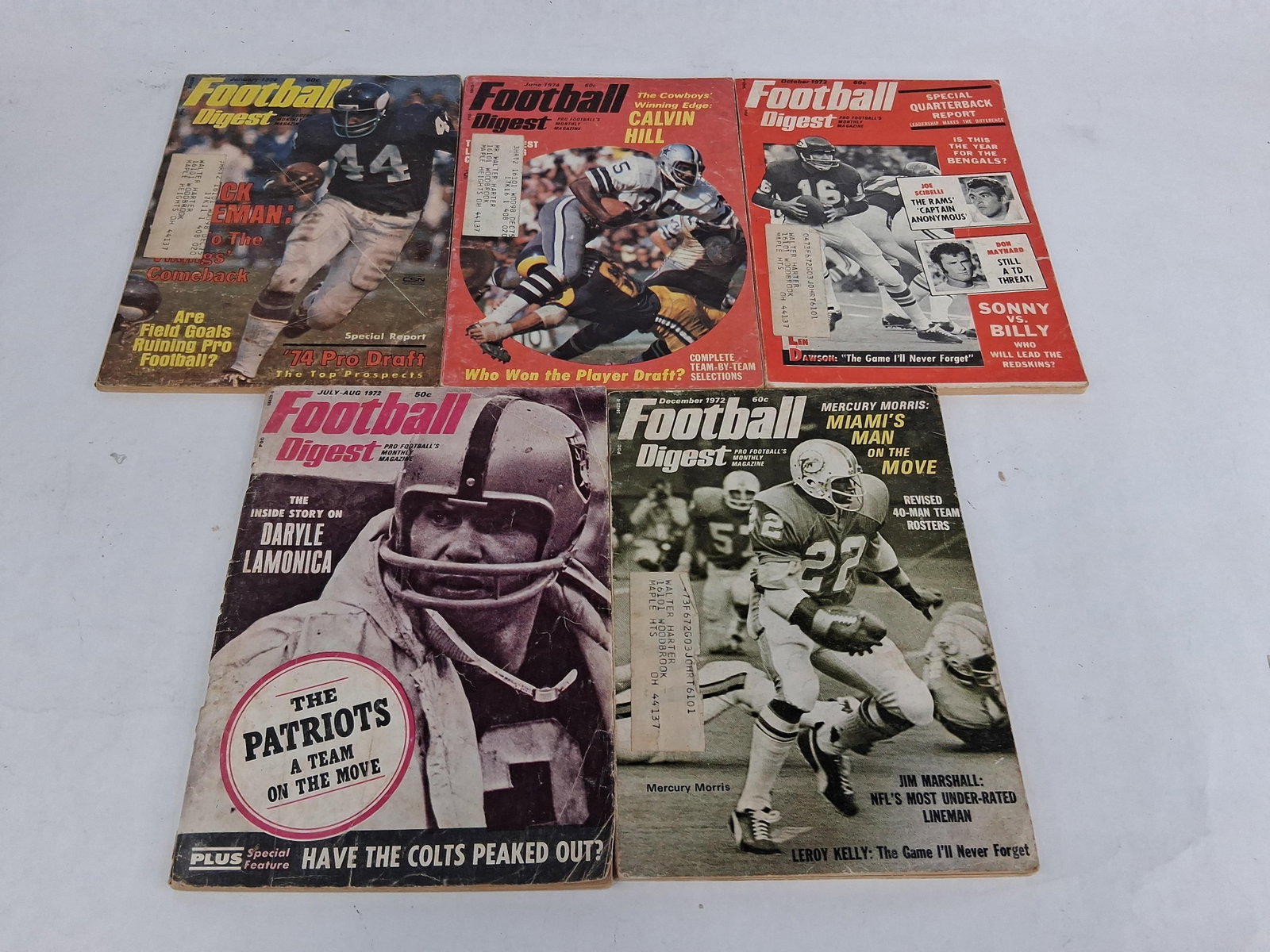 Set 5 Football Digest w/ Lamonica, 1972-1974: A collection of five original Football Digest magazines published between 1972 and 1974. These staple-bound newsprint periodicals feature prominent NFL players and teams of the era. The grouping