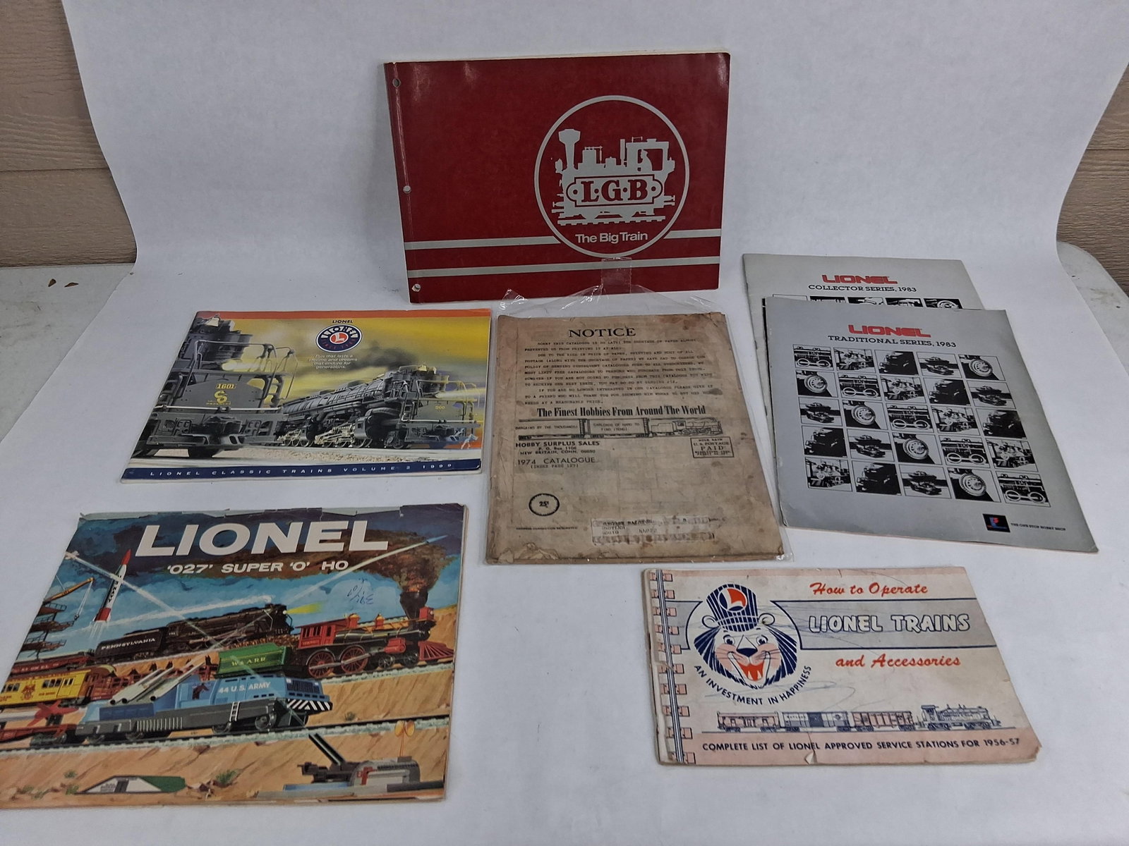 Lionel & LGB Train Catalogs & Manuals: This collection consists of seven model train catalogs and reference manuals spanning the mid-1950s through the late 1990s. The assortment primarily focuses on the Lionel brand with one large-format