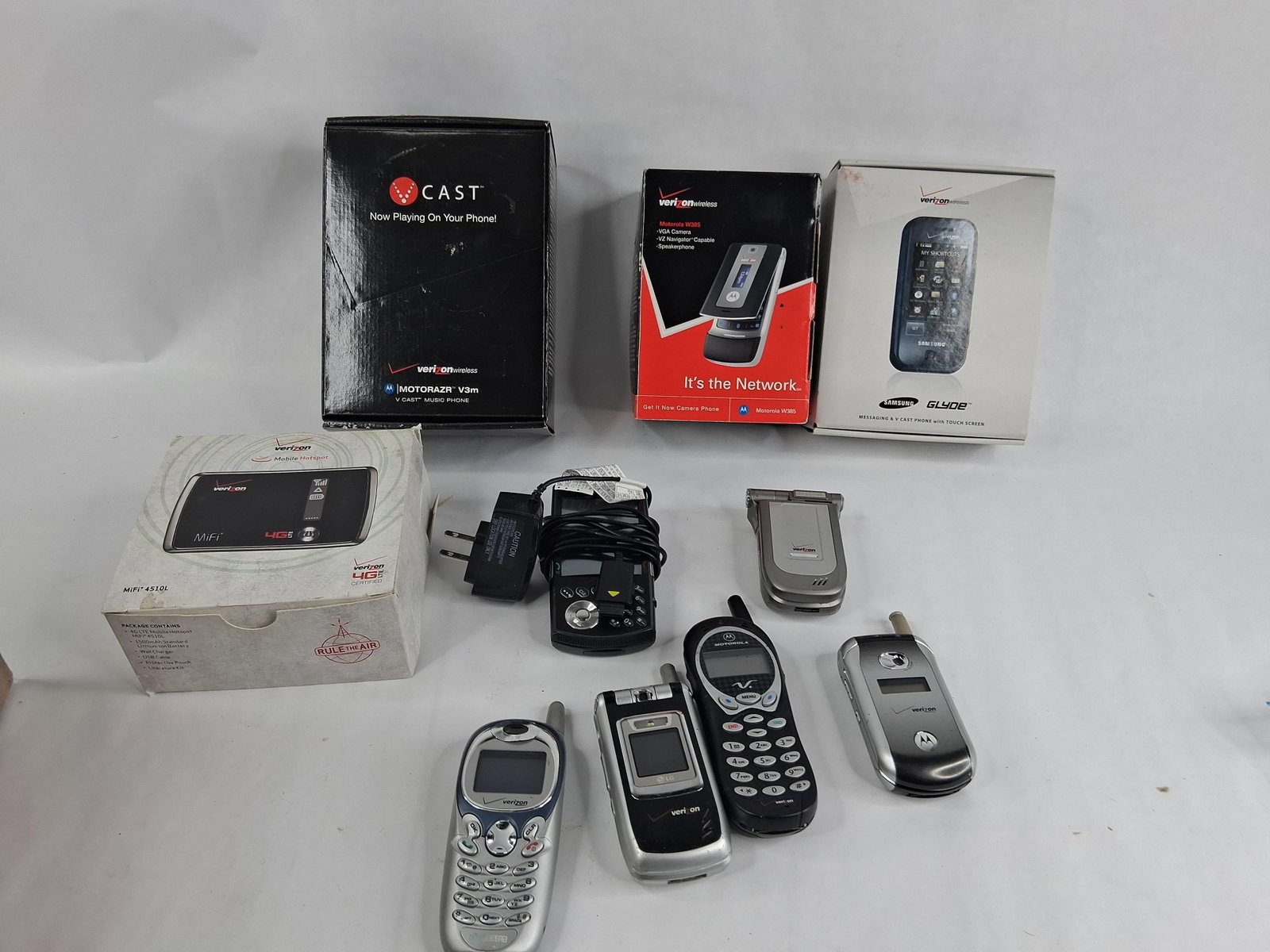 Verizon Motorola RAZR, Samsung Glyde & Hotspot: An assortment of cellular telephones and mobile networking equipment branded for the Verizon Wireless carrier. The collection features devices from manufacturers including Motorola, Samsung, LG,