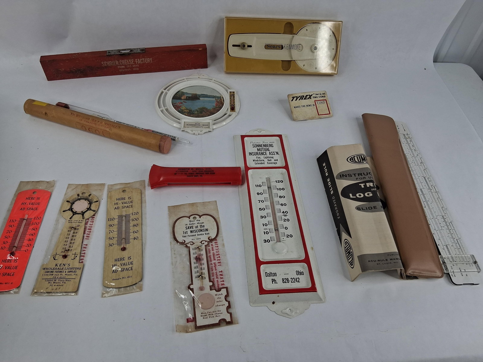 Mid-C. American Advertising Thermometers & Tools: This lot features an assortment of approximately eleven mid-20th-century American promotional items and scientific instruments, primarily representing businesses from the Midwest and Southern United
