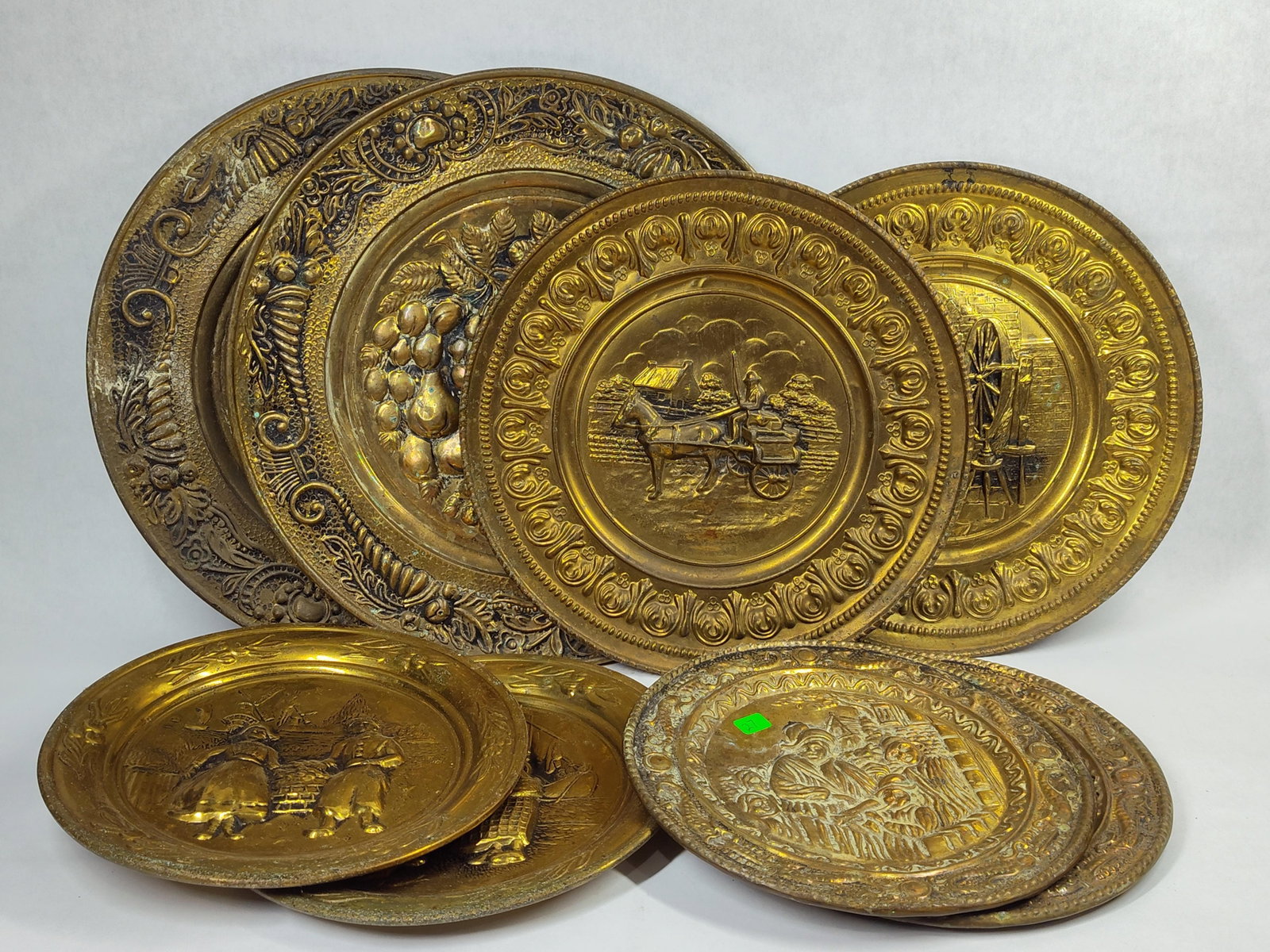 Collection of Eight Embossed Brass Decorative Chargers and Plates Attributed to Peerage (1 of 5)