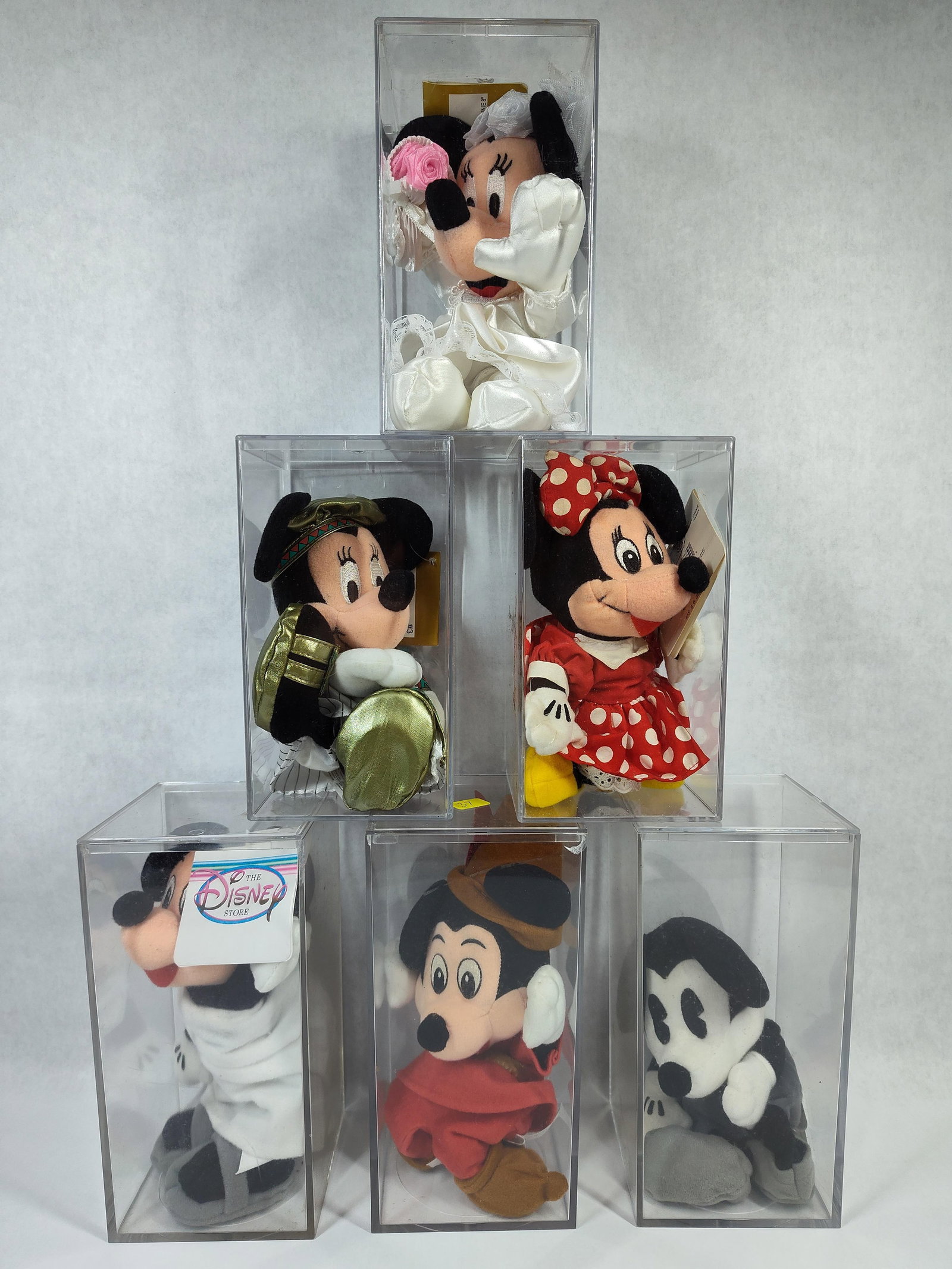 Disney Mickey & Minnie Through the Years Plush Set: A set of six collectible plush toys manufactured for The Disney Store, featuring characters from the Disney animation universe in various historical and thematic costumes. The collection includes thre