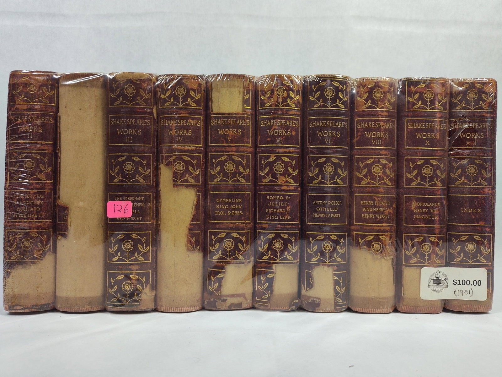 Shakespeare, Works, Half-Leather Set, c. 1901: This collection consists of multiple volumes of the works of William Shakespeare, bound in half-leather with red marbled paper boards. The spines feature four compartments with gilt-stamped floral