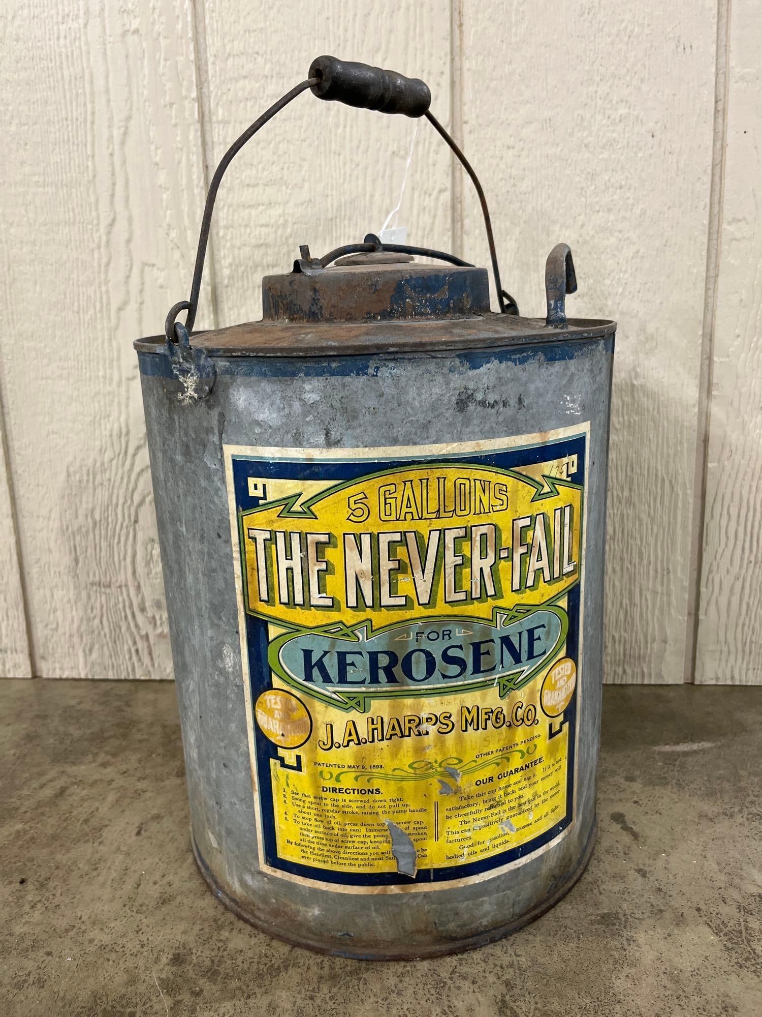 J.A. Harps Mfg. Co. Never-Fail Kerosene Pump Can: This antique liquid fuel dispenser was manufactured by the J.A. Harps Manufacturing Company of Greenfield, Ohio. Identified as The Never-Fail model, the piece consists of a cylindrical body