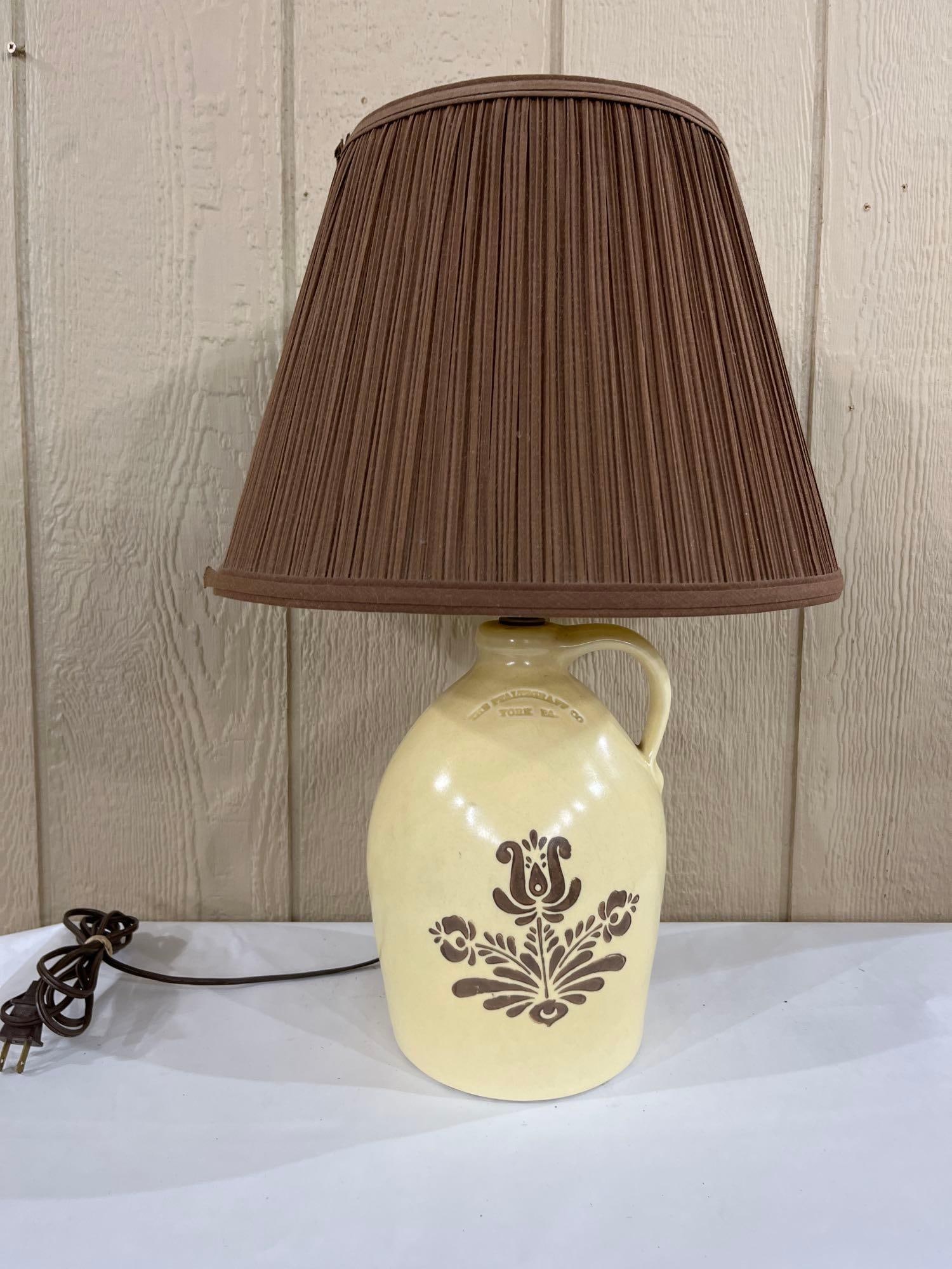 Pfaltzgraff Village Stoneware Jug Table Lamp: This table lamp is composed of a stoneware jug base manufactured by The Pfaltzgraff Co. of York, Pennsylvania. The jug features the Village pattern, characterized by a cream-colored glaze and a