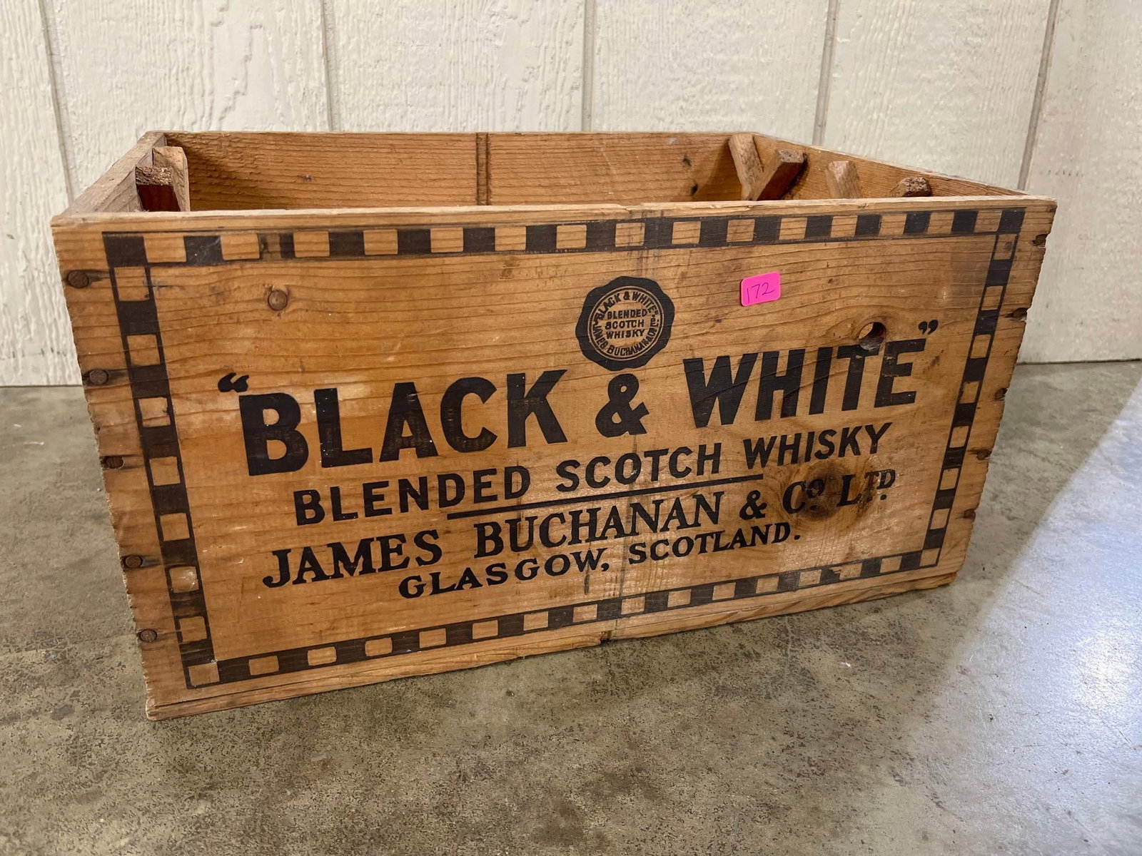 James Buchanan Black & White Scotch Whisky Crate: This vintage wooden shipping crate was produced for Black and White Blended Scotch Whisky by James Buchanan and Co. Ltd of Glasgow, Scotland. The rectangular container is constructed from softwood