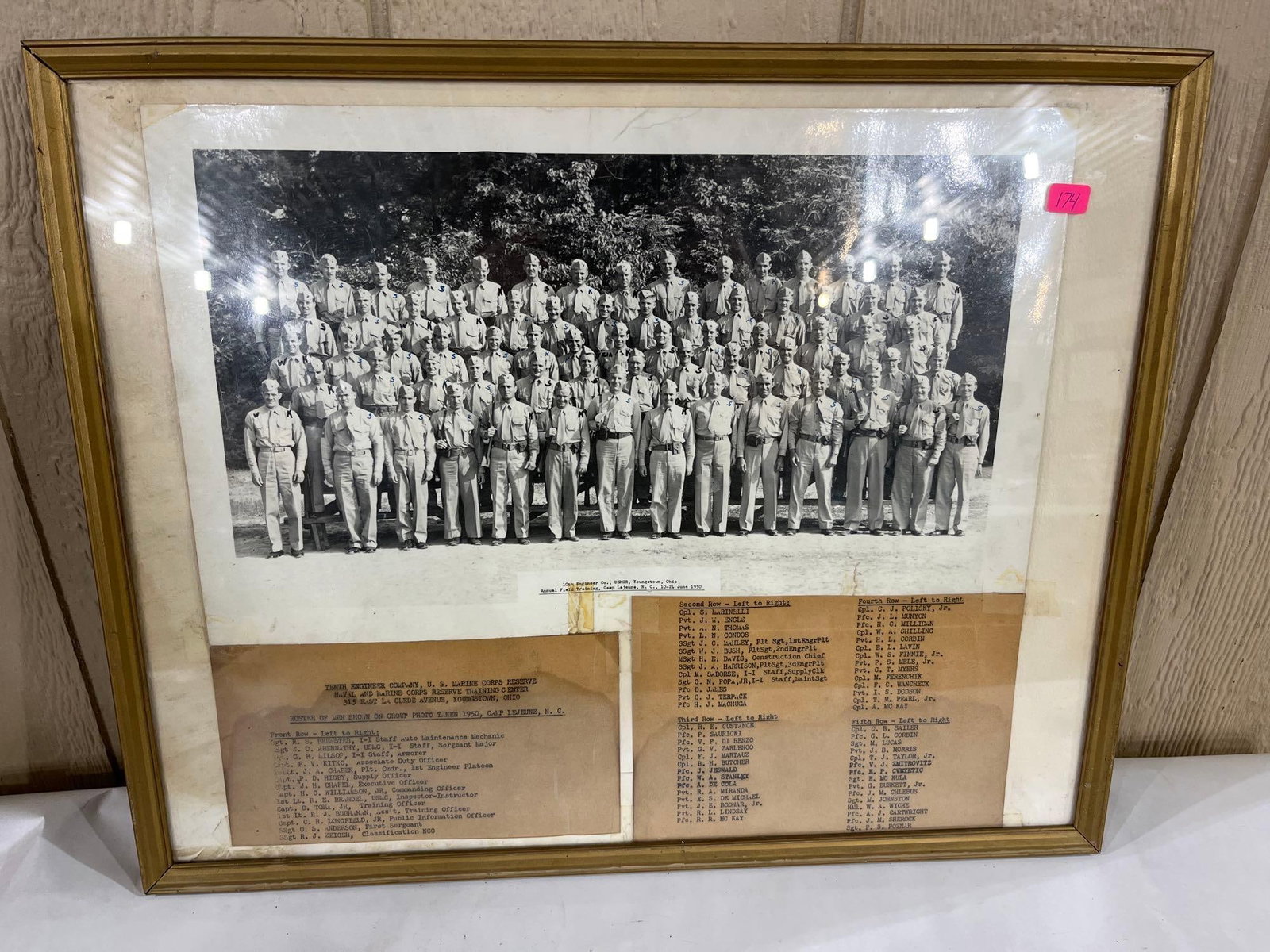 1950 USMC Reserve 10th Engineer Co. Photo & Roster: A framed black and white historical group photograph and typed unit roster for the Tenth Engineer Company, U.S. Marine Corps Reserve. The unit was based at the Naval and Marine Corps Reserve Training