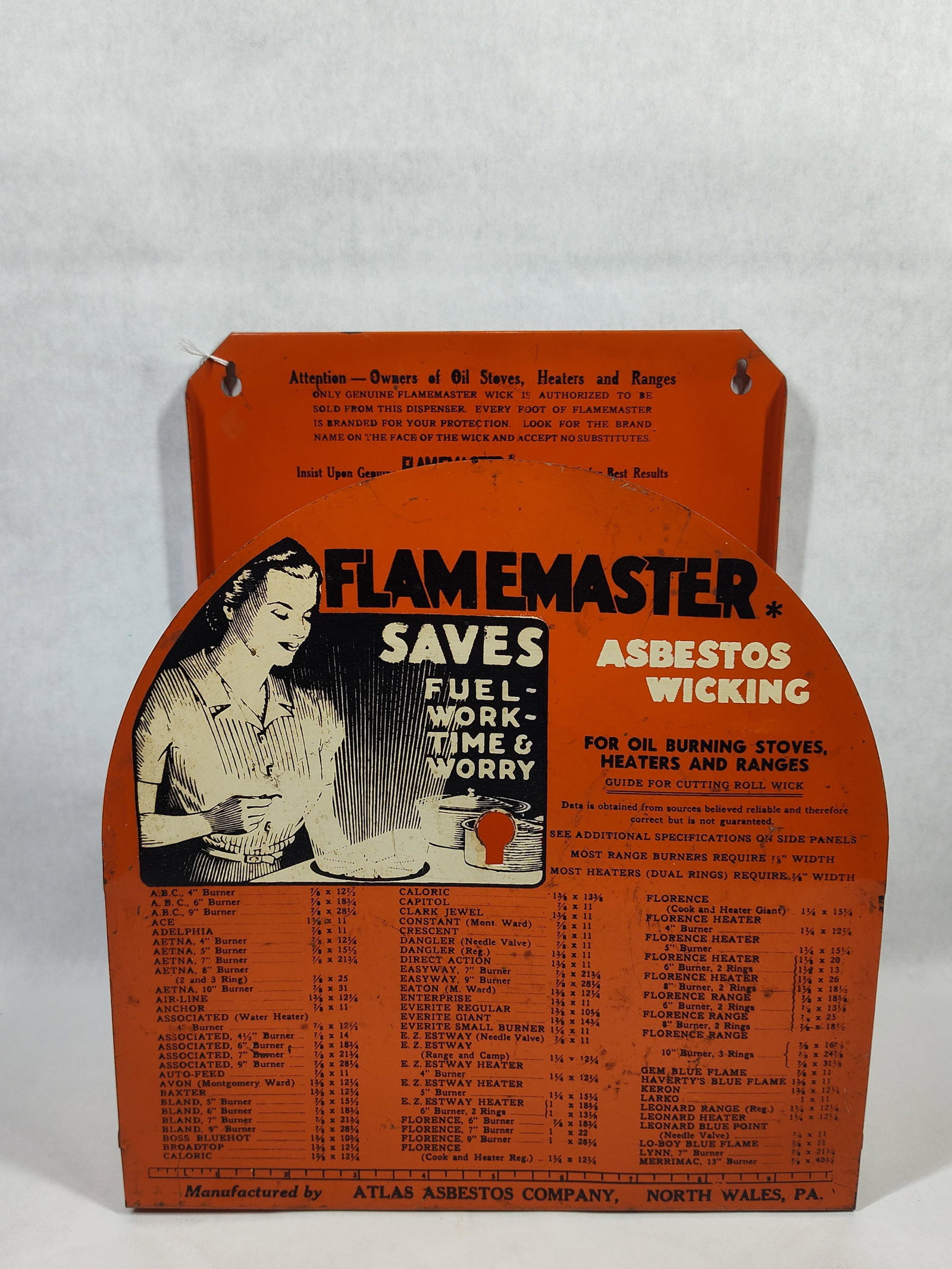 Flamemaster Asbestos Wicking Advertising Dispenser: This is a vintage countertop or wall-mounted point-of-sale dispenser designed for Flamemaster brand asbestos wicking, intended for use with oil-burning stoves, heaters, and ranges. The unit is