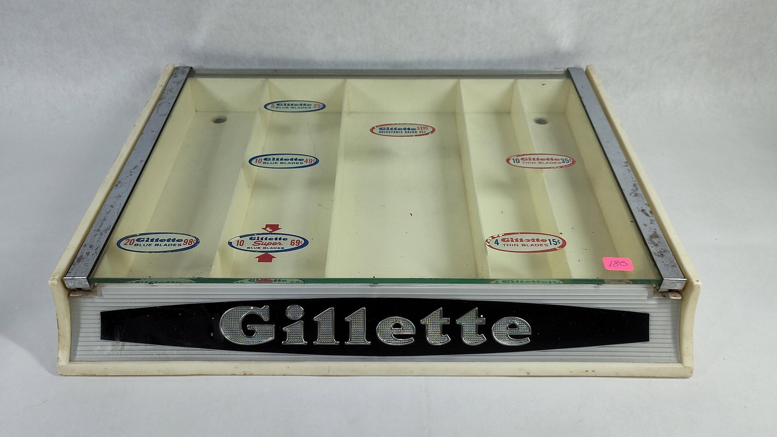 Gillette Razor & Blade Advertising Display Case: This vintage point-of-sale display case was manufactured by the Gillette Safety Razor Company for retail use. The unit consists of a molded white plastic housing with a chrome-plated metal frame and