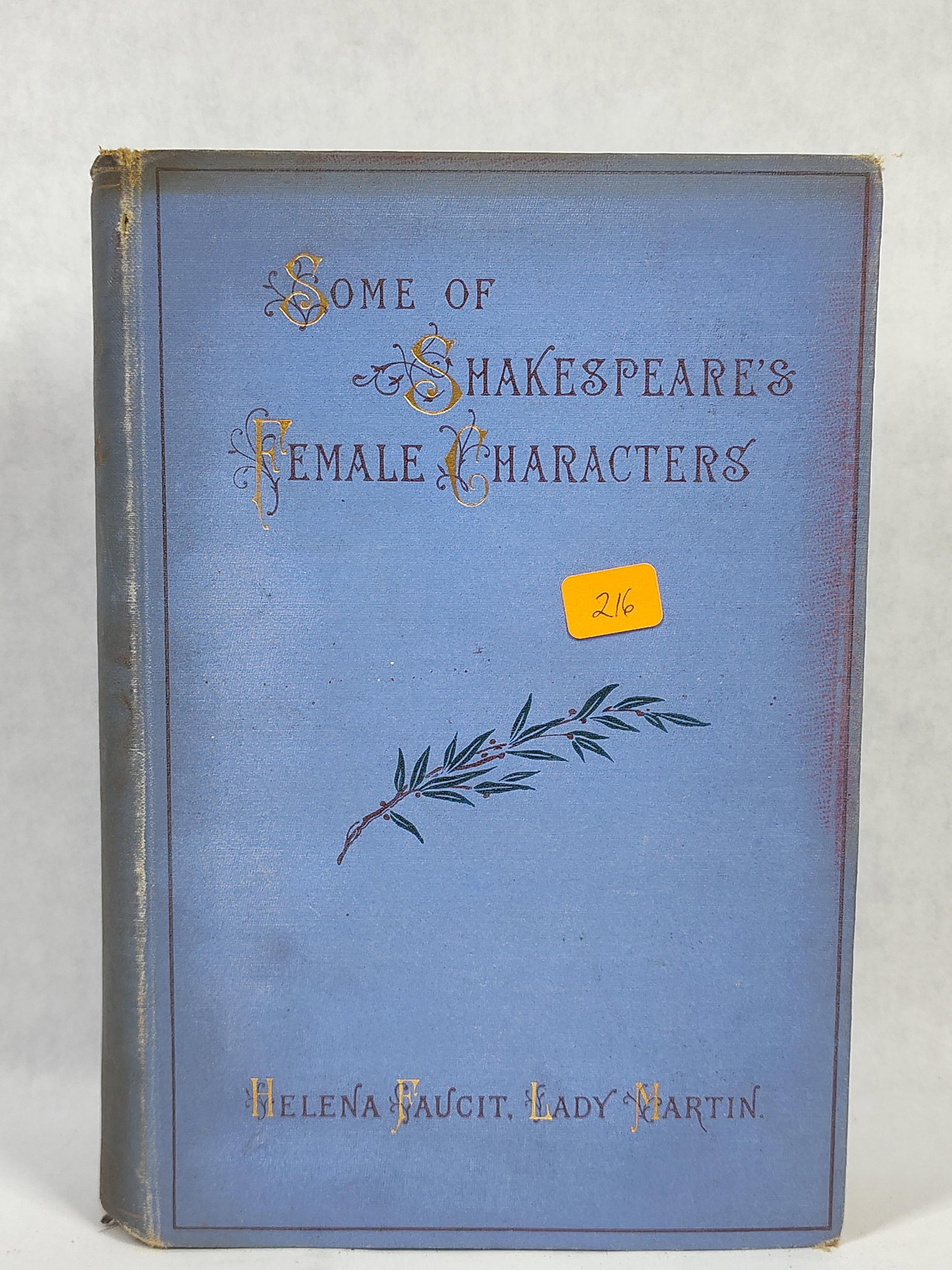 H. Faucit, Shakespeare's Female Characters, 1893: This octavo volume is bound in the publisher's original blue cloth with gilt-stamped lettering and decorative elements on the front board and spine. The front cover features stylized, ornate initial