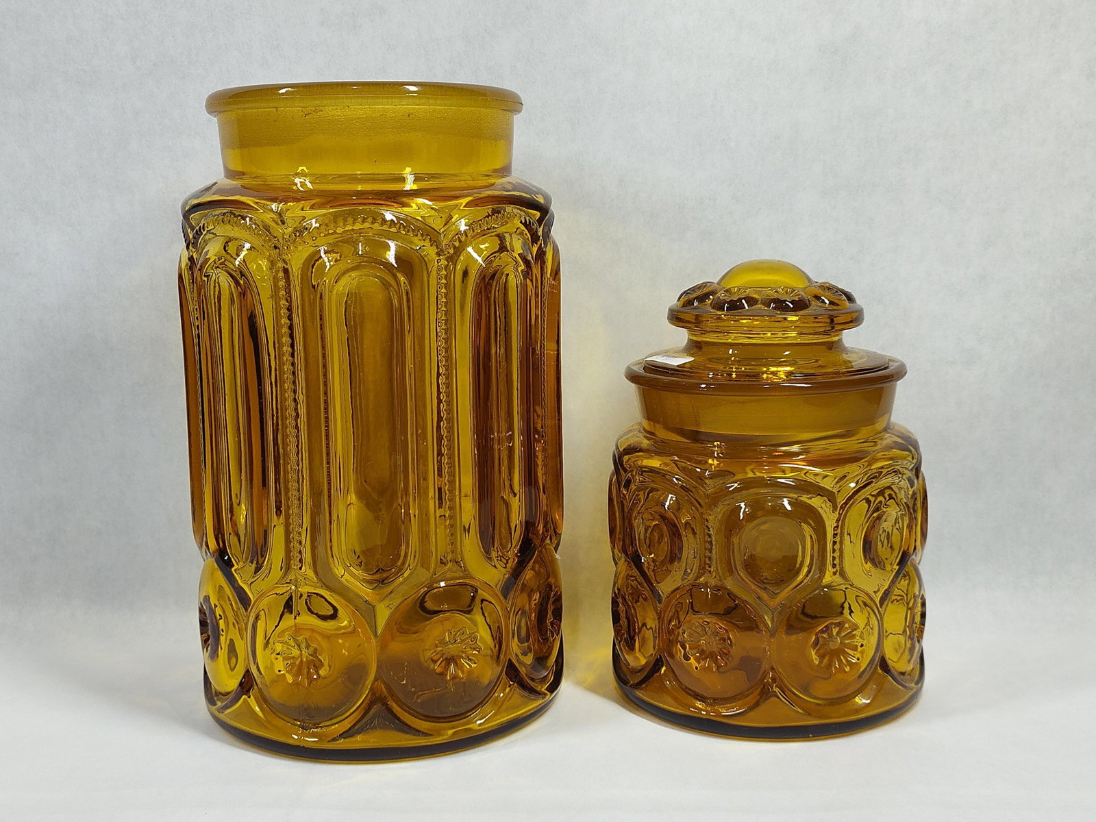 Pair Moon & Star Pattern Amber Glass Canisters (1 of 4)