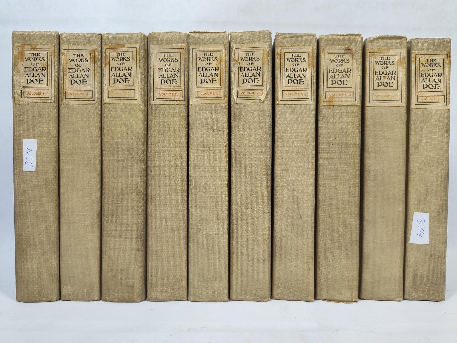 Poe, Edgar Allan. The Works, 10-Vol. Set, 1908: A ten-volume set of the collected works of Edgar Allan Poe, published in 1908 by The Werner Company and identified as the Library Edition. The volumes are bound in the publisher's tan cloth with