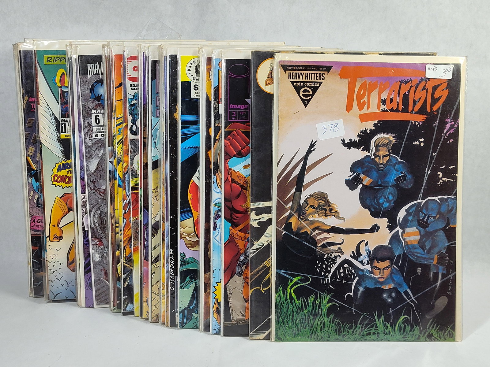 Multiple Publishers Modern Age Comic Books,: A collection of comic books from the early to mid-1990s, featuring various titles from publishers including Epic Comics, Malibu Comics, Image Comics, Dark Horse Comics, and Entity Comics. Included in