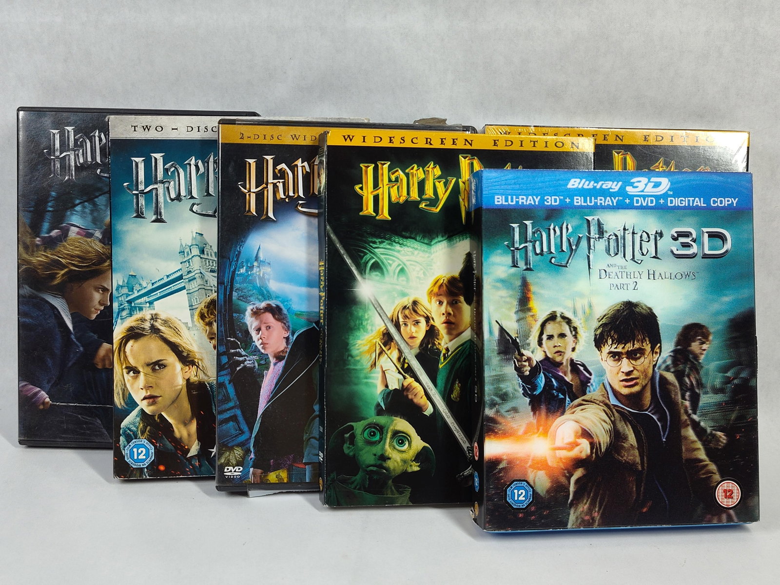 Warner Harry Potter Films DVD & Blu-ray 2002-2011: This collection includes multiple home media releases from the Harry Potter film franchise. The lot contains two copies of Harry Potter and the Chamber of Secrets (DVD, Widescreen Edition), one of