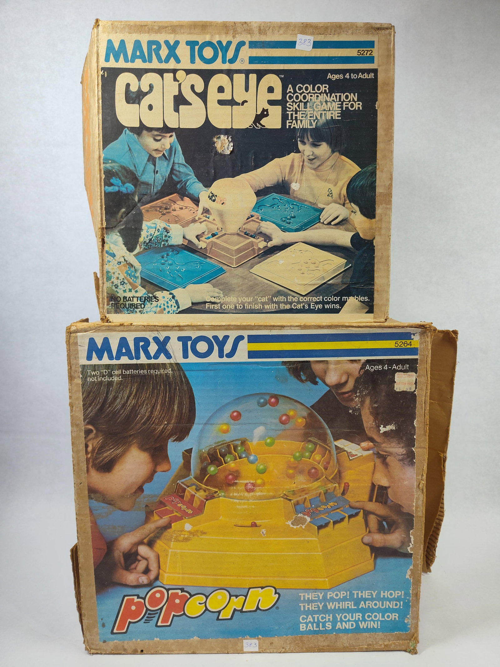 Marx Toys Vtg Games: Cat's Eye & Popcorn, Pair: Marx Toys manufactured these two vintage games, Cat's Eye and Popcorn. Cat's Eye, model 5272, is a color coordination skill game that includes a central orange base, a yellow funnel, four player
