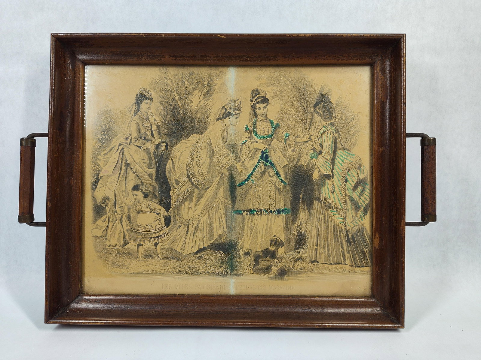 Illman Brothers Peterson's Fashion Engraving Tray: This late 19th-century hand-colored fashion engraving, titled Les Modes Parisiennes, was originally produced for Peterson's Magazine. The print depicts four Victorian women and a young child in
