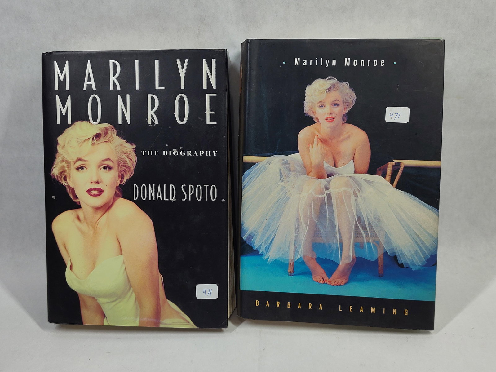 Spoto & Leaming 2 Marilyn Monroe Biographies w/DJ: This lot features two hardcover biographical volumes focusing on the life of Marilyn Monroe. The first volume is titled Marilyn Monroe: The Biography by Donald Spoto, published in 1993. The second
