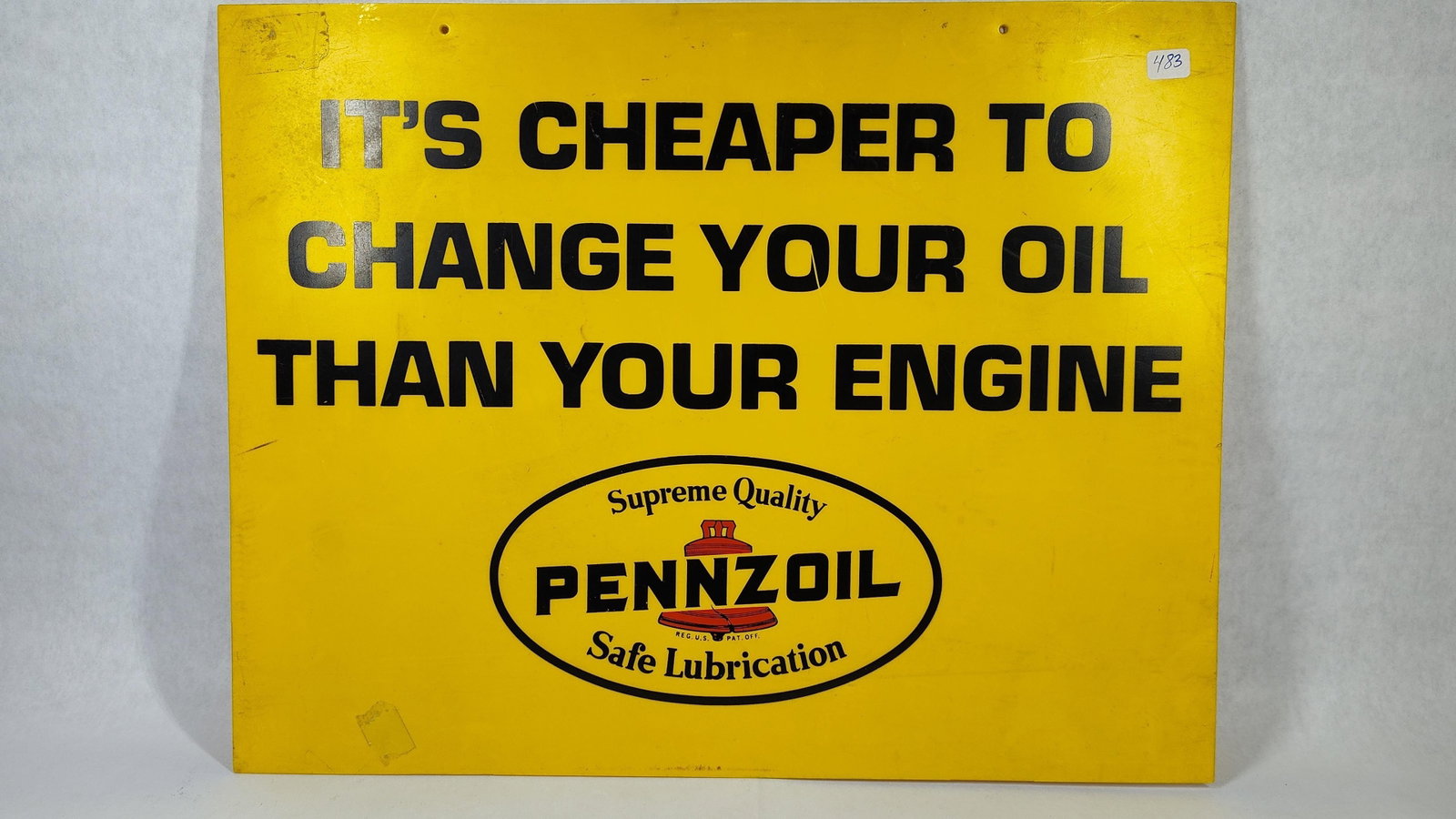 Pennzoil Single-Sided Dealer Service Sign: This Pennzoil dealer service sign is an original piece of mid-20th-century petroliana. It is constructed from a single sheet of painted metal and features a bright yellow background. The primary
