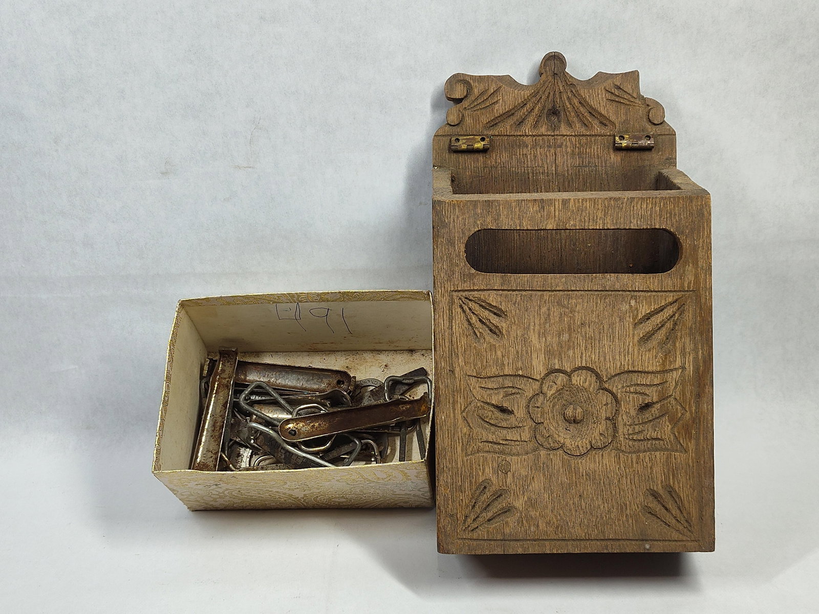 French Provincial Salt Box & Advertising Openers: This lot features a hand-carved wooden wall-mounted box, consistent in form and decoration with a French Provincial salt box, or boite a sel. The box is constructed with a hinged top lid and features
