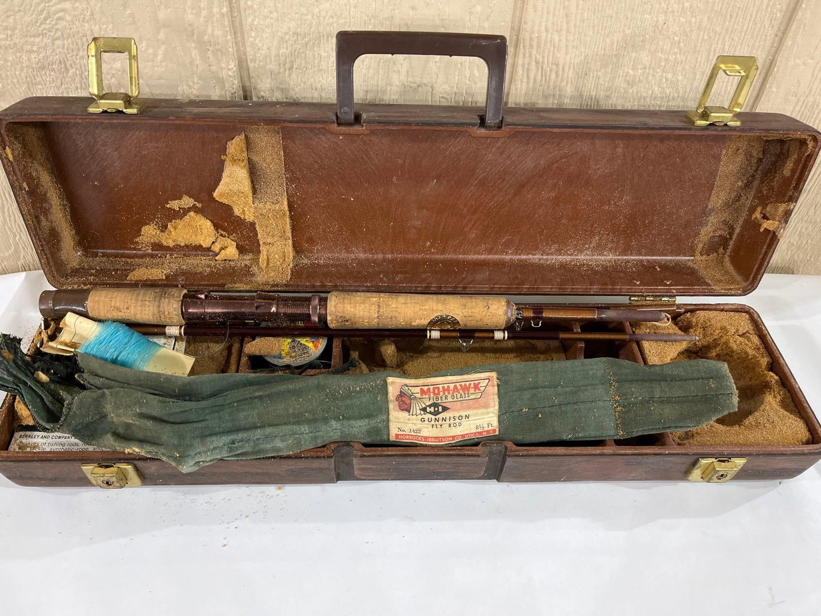 Horrocks-Ibbotson & Berkley Fly Fishing Ensemble: A vintage fly fishing set featuring an 8 1/2-foot fiberglass fly rod and associated equipment. The rod is constructed with a cork grip featuring an inset gold-toned medallion marked Berkley