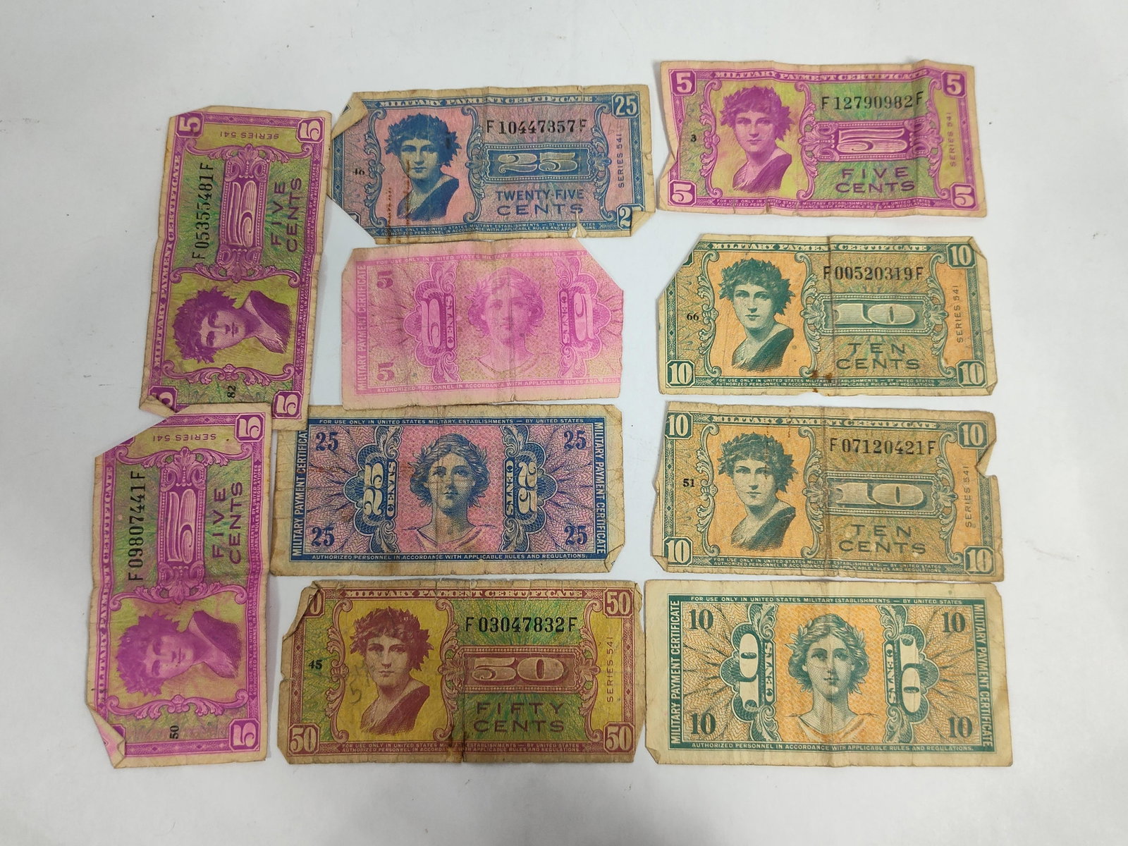 US Military Payment Certificates, Series 541: This collection consists of multiple United States Military Payment Certificates (MPC) from Series 541, which were issued for use in US military establishments between 1958 and 1961. The assortment