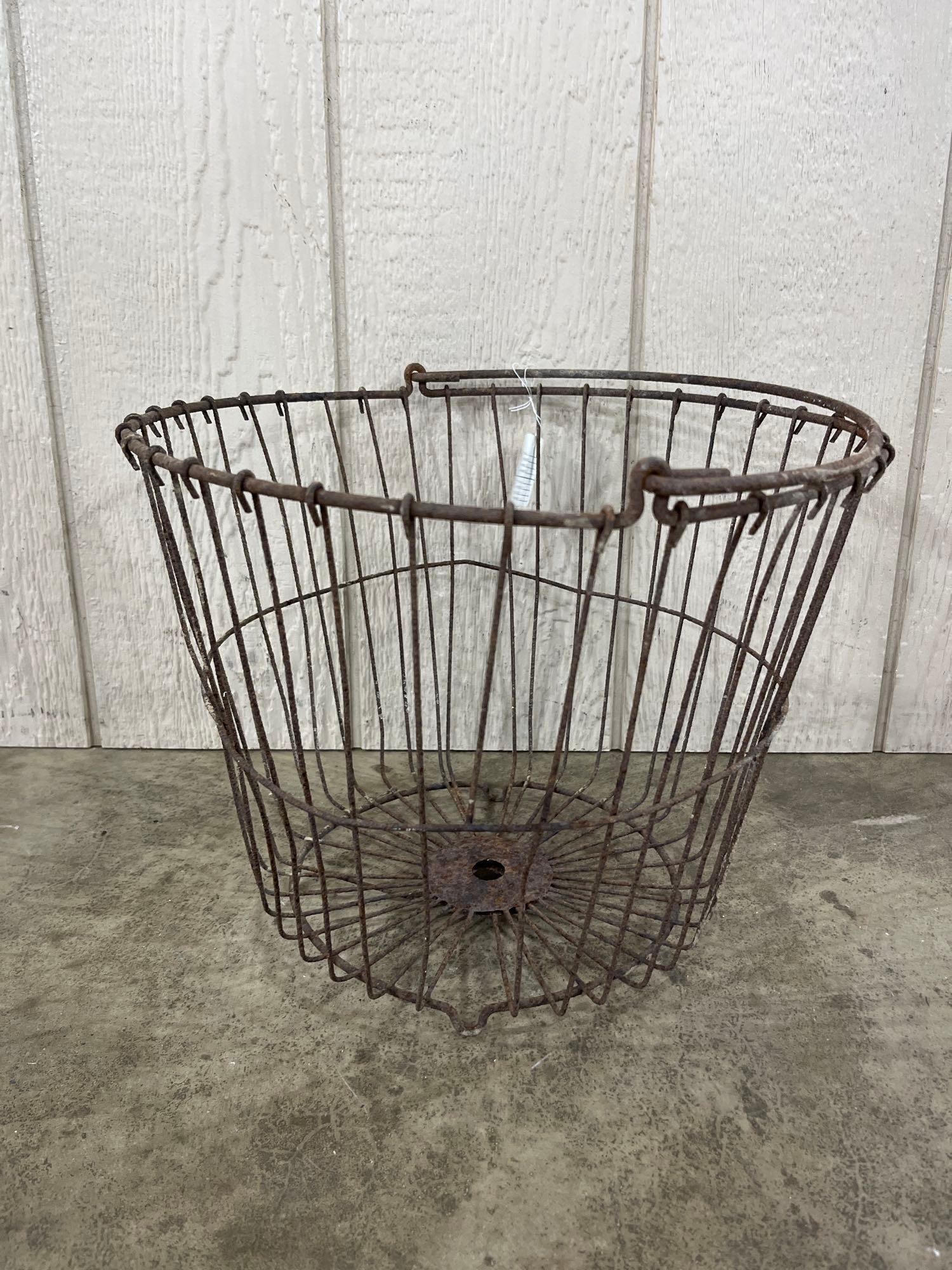 Vtg Industrial Wire Harvest & Egg Basket: A vintage industrial-style wire basket constructed from heavy-gauge wire and sheet metal components. The basket is designed with a tapered circular form, featuring numerous vertical wire ribs that are
