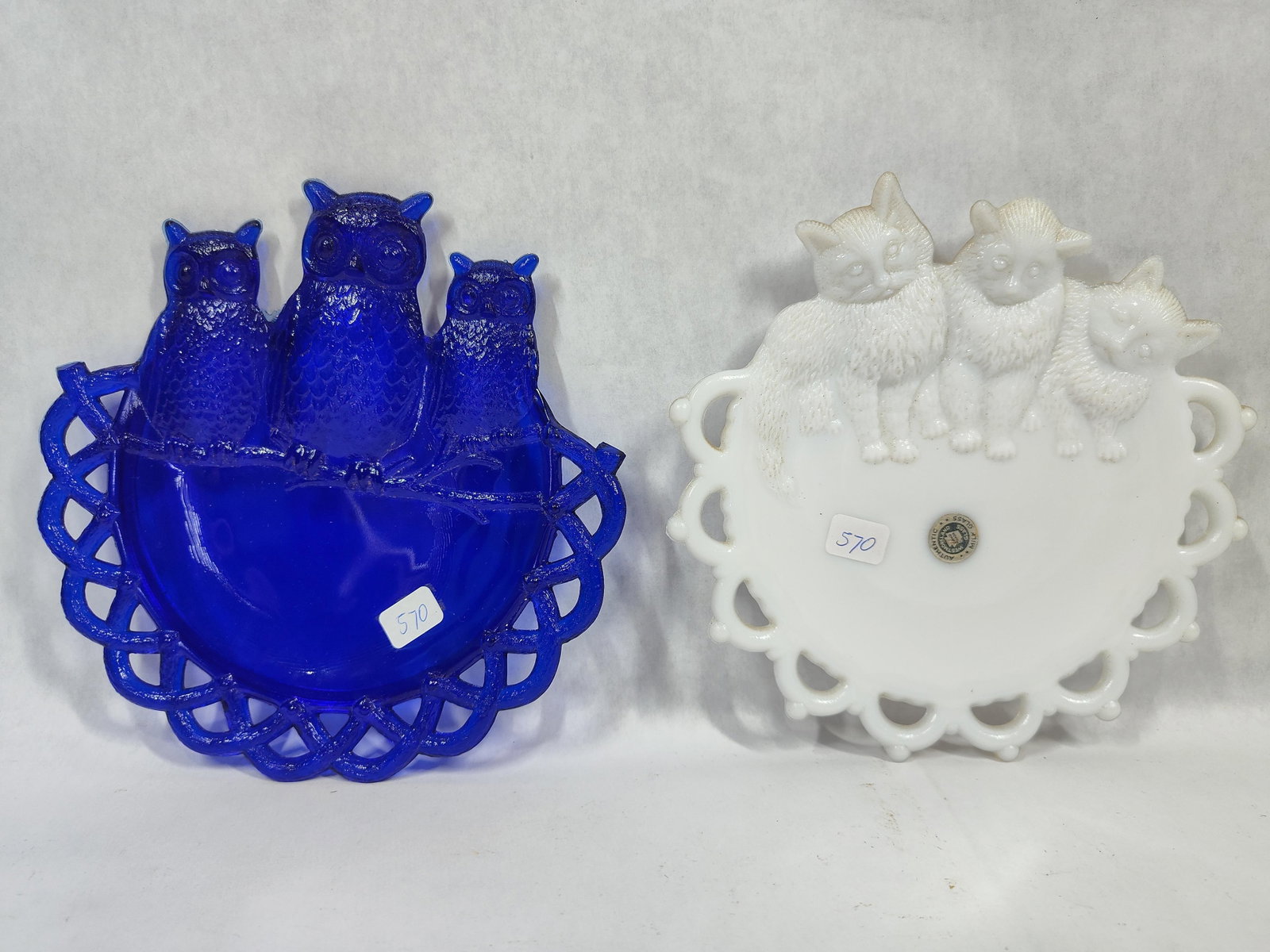 Pair Westmoreland Glass Animal Openwork Plates: This lot features a pair of vintage decorative glass plates with embossed animal figures and openwork borders, manufactured by the Westmoreland Glass Company. The first plate is made of translucent