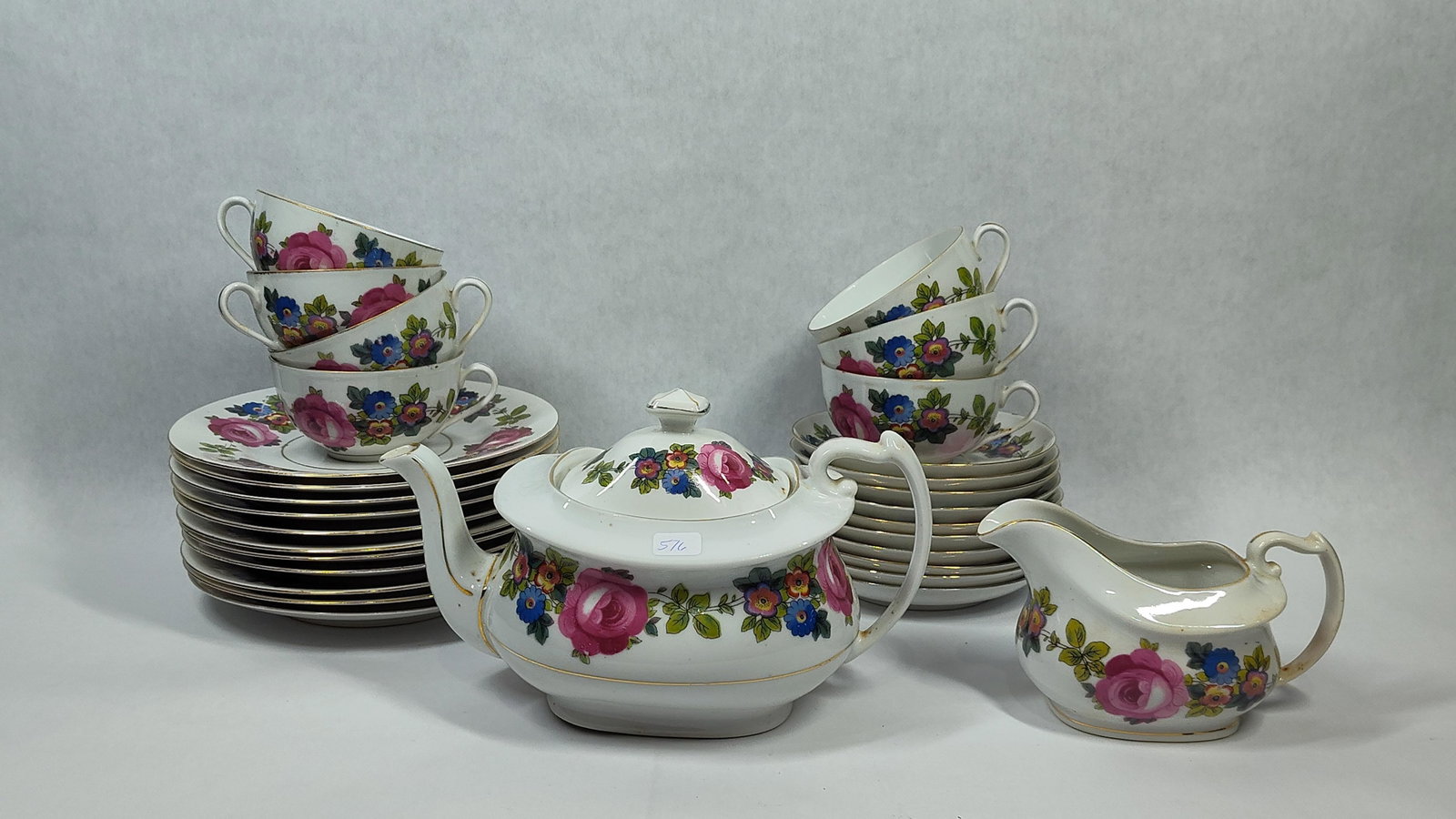 Phoenix China Czech Floral Porcelain Tea Set: This porcelain tea set was manufactured by Phoenix China in Czechoslovakia, likely dating to the interwar period. The pieces are decorated with a multi-colored transfer-printed floral pattern