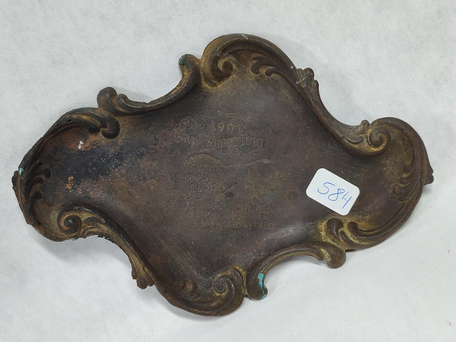 1901 Pan-American Expo Cast Metal Buffalo Tray: This commemorative souvenir tray was produced for the 1901 Pan-American Exposition held in Buffalo, New York. The item is constructed of cast copper-alloy with an irregular, scalloped form featuring