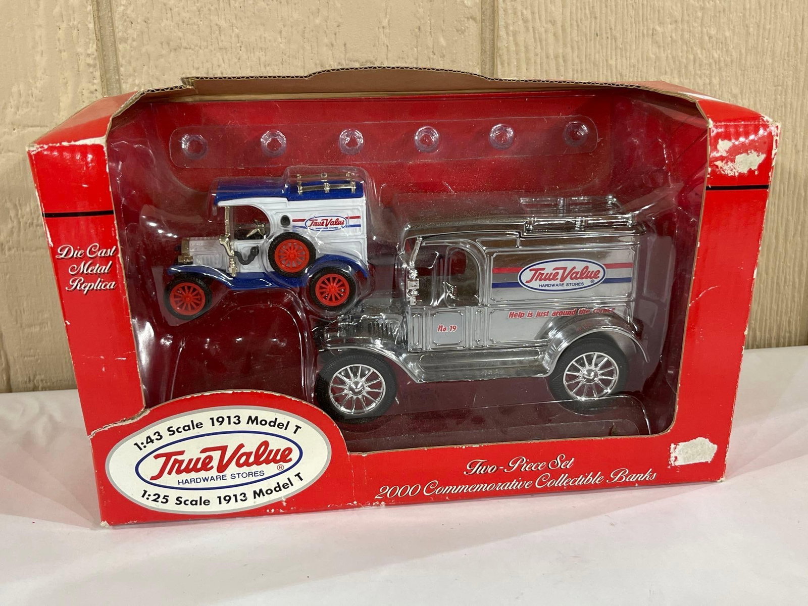 Ertl True Value 2000 1913 Model T Bank Set: This Ertl Collectibles set produced for True Value Hardware Stores features two die-cast metal still bank replicas of 1913 Ford Model T delivery vans. The 1:43 scale vehicle is finished in a white and