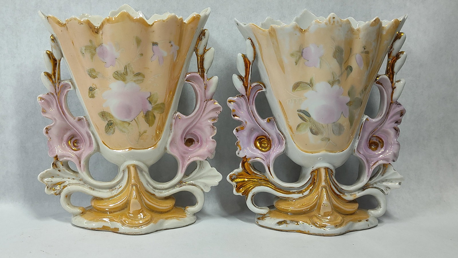 Pair Old Paris Style Hand-Painted Porc. Vases: A pair of porcelain vases in the Rococo Revival style, characteristic of 19th-century Old Paris (Vieux Paris) porcelain. Each vase features a flared, scalloped rim and integral side handles composed
