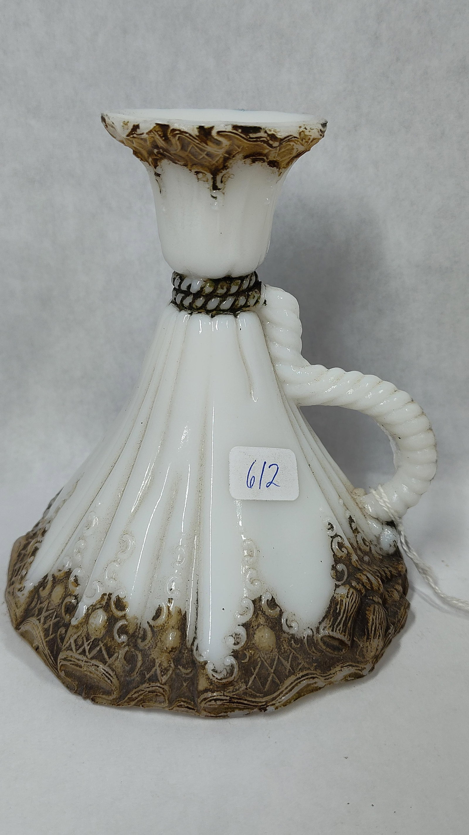 Attrib. Dithridge & Co. Milk Glass Chamberstick: This late 19th or early 20th-century handled chamber candlestick, often referred to as a napper, is attributed to Dithridge and Company. The piece is constructed from opaque white pressed milk glass.