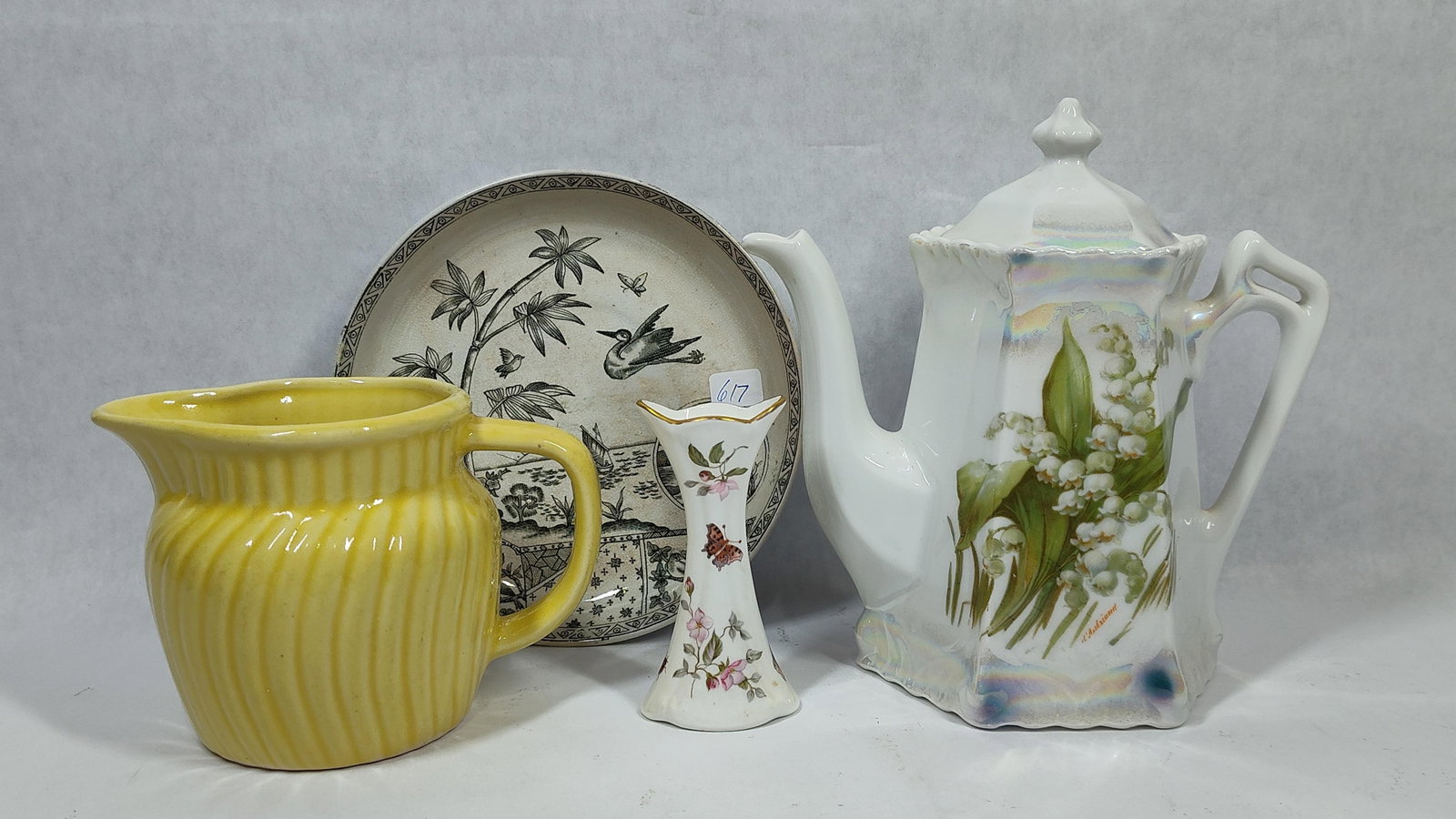 Edge Malkin & Sturbridge English & German Ceramics: This collection includes several ceramic items of English and German origin. One circular earthenware plate by Edge, Malkin and Co. of Burslem, Staffordshire, features the Tonquin pattern in a black