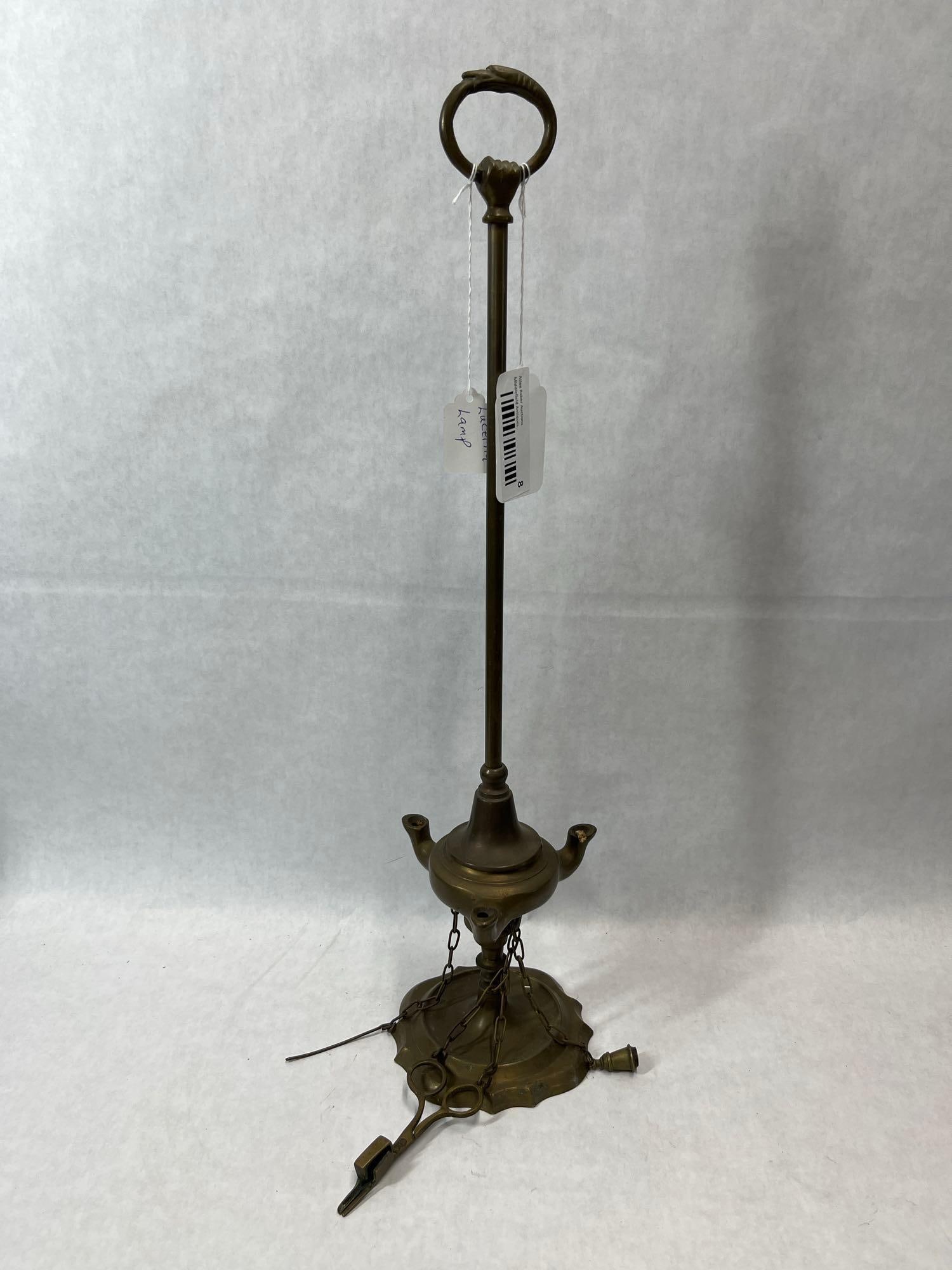 Italian Grand Tour Brass 3-Spout Lucerna Oil Lamp: An Italian Grand Tour Lucerna oil lamp constructed from cast and turned brass. The piece consists of a scalloped circular base supporting a slender central column. A ring handle at the top is