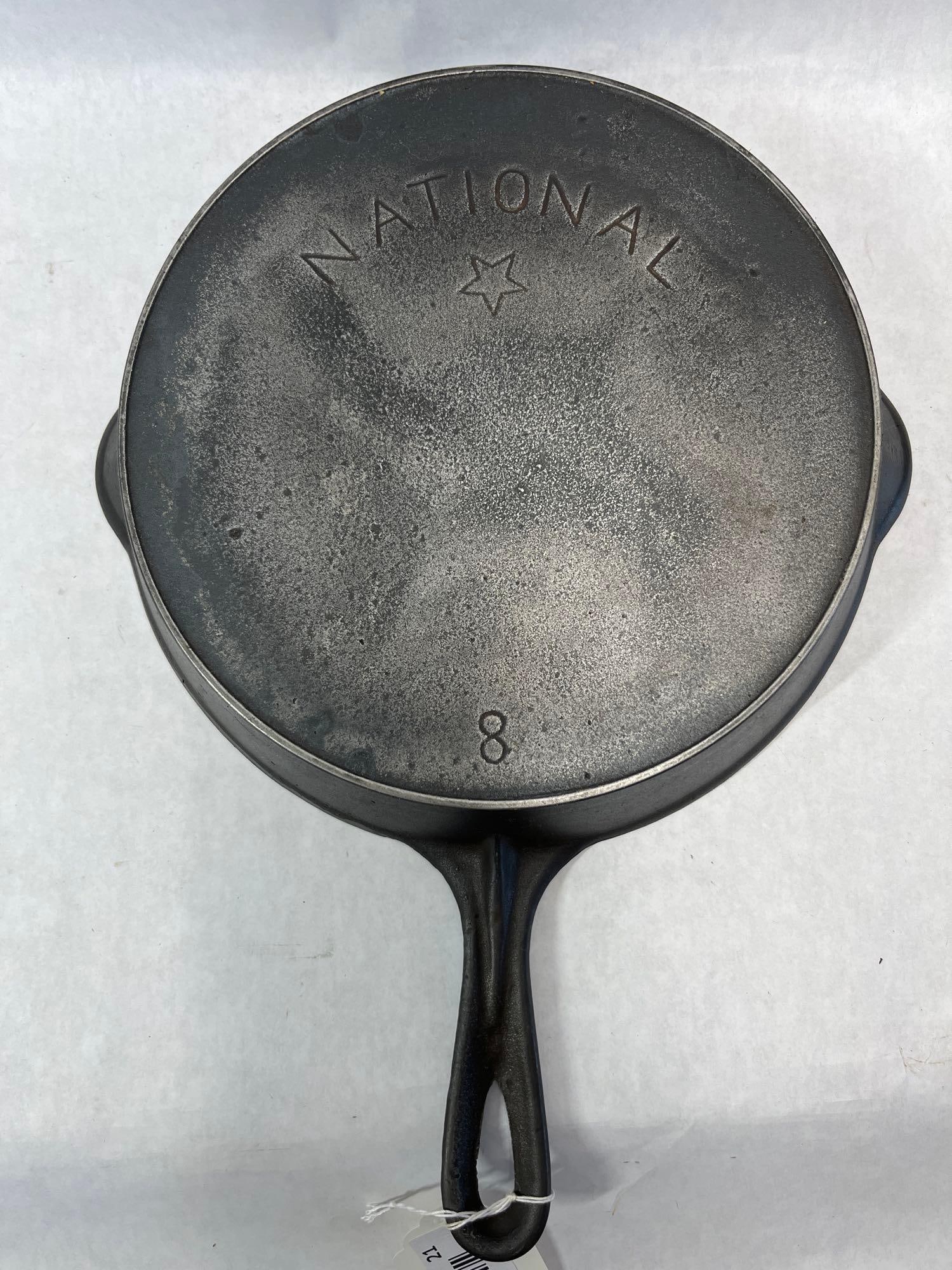Wagner National Cast Iron Skillet: This cast iron skillet was produced under the National brand name, a secondary line of cookware manufactured by the Wagner Manufacturing Company in Sidney, Ohio. The underside of the pan features the