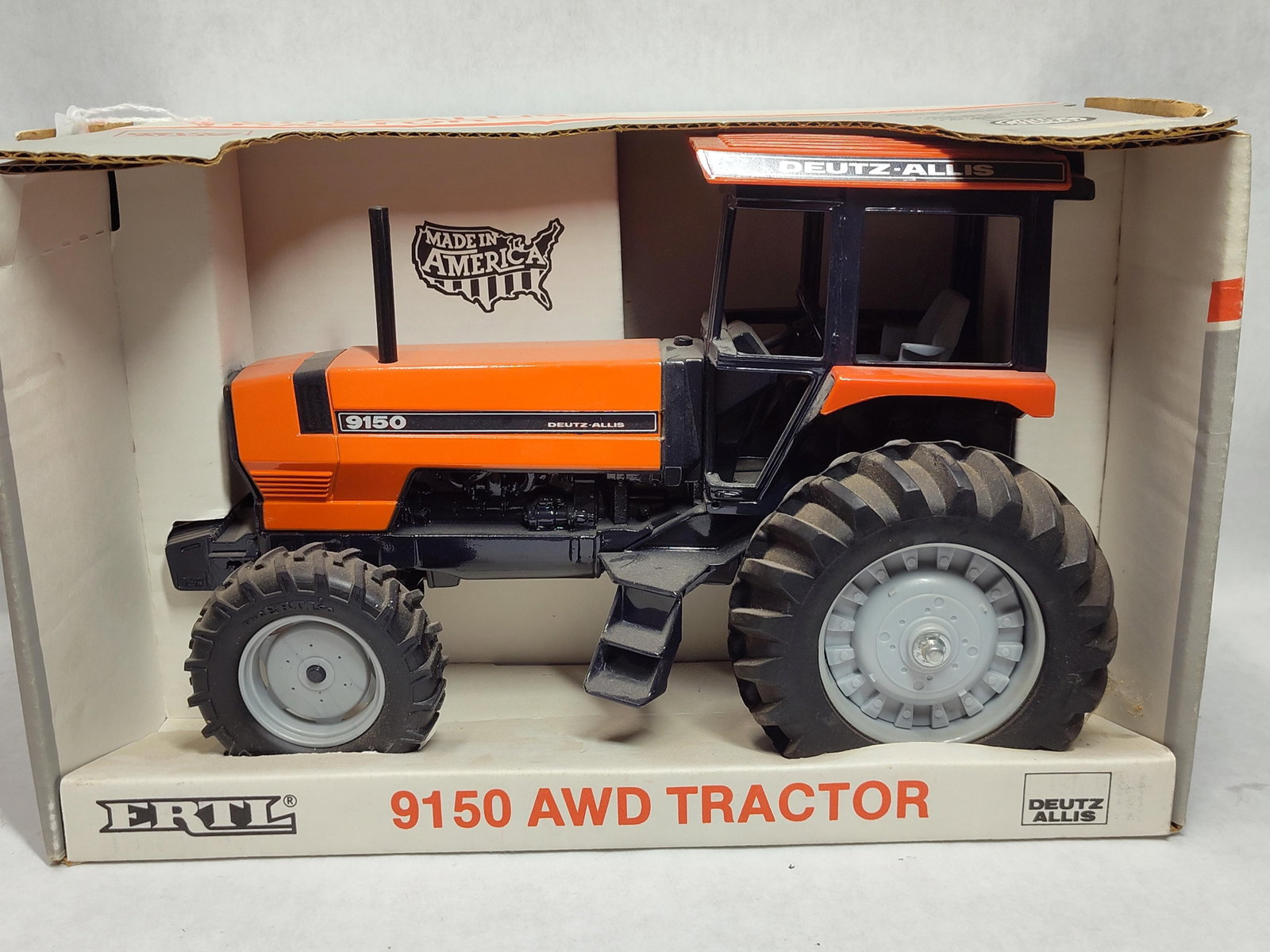 Ertl 1/16 Deutz-Allis 9150 AWD Tractor w/ Box: This is a 1/16 scale replica of a Deutz-Allis 9150 AWD tractor manufactured by The Ertl Company, Inc., based in Dyersville, Iowa. The tractor is constructed with a die-cast metal body, rubber tires,