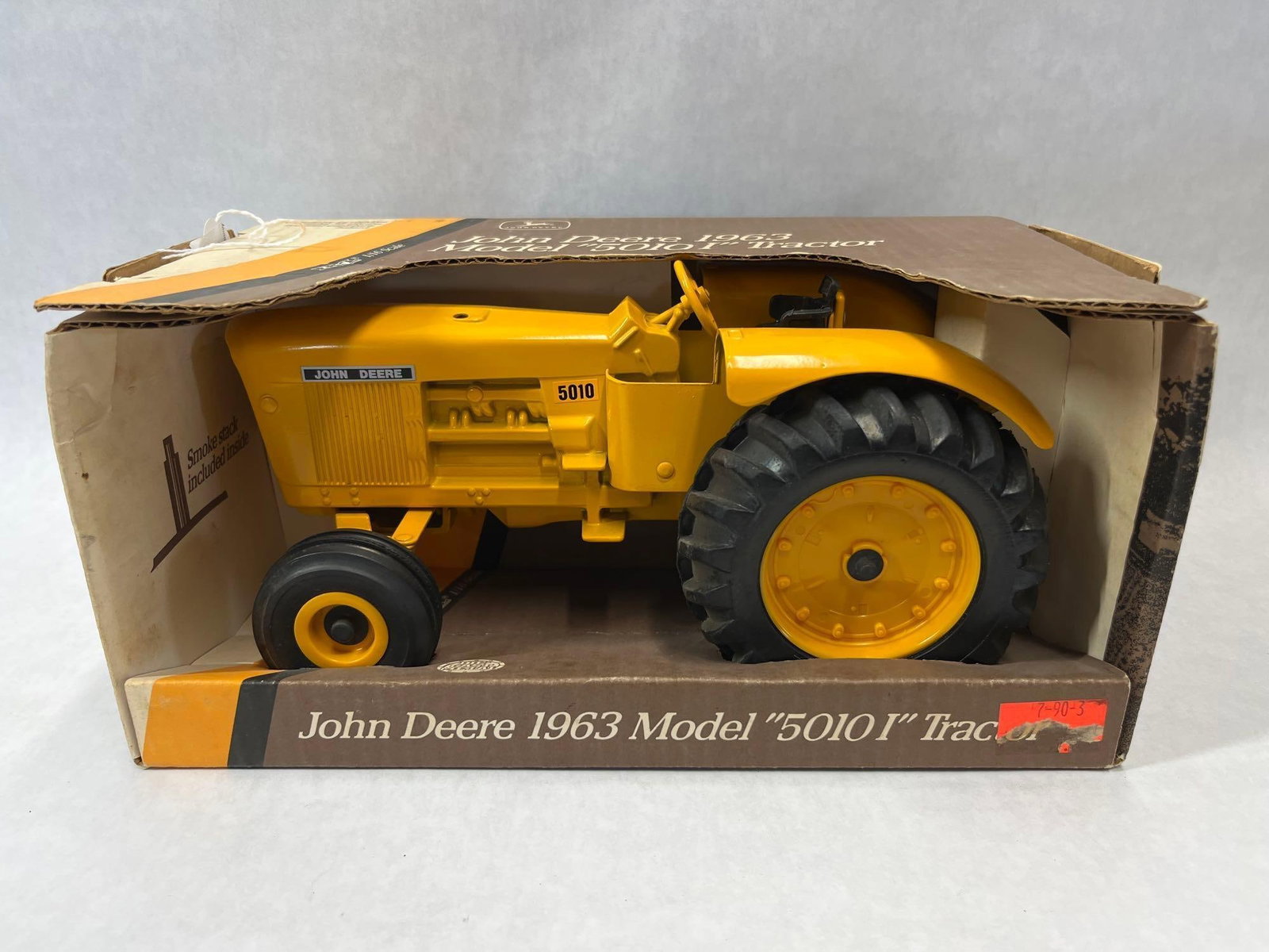 Ertl 1/16 John Deere 1963 5010 I Tractor w/ Box: This Ertl die-cast metal model is a 1/16 scale replica of the John Deere 1963 Model 5010 I industrial tractor. The item is finished in industrial yellow paint and features a steerable front axle, a