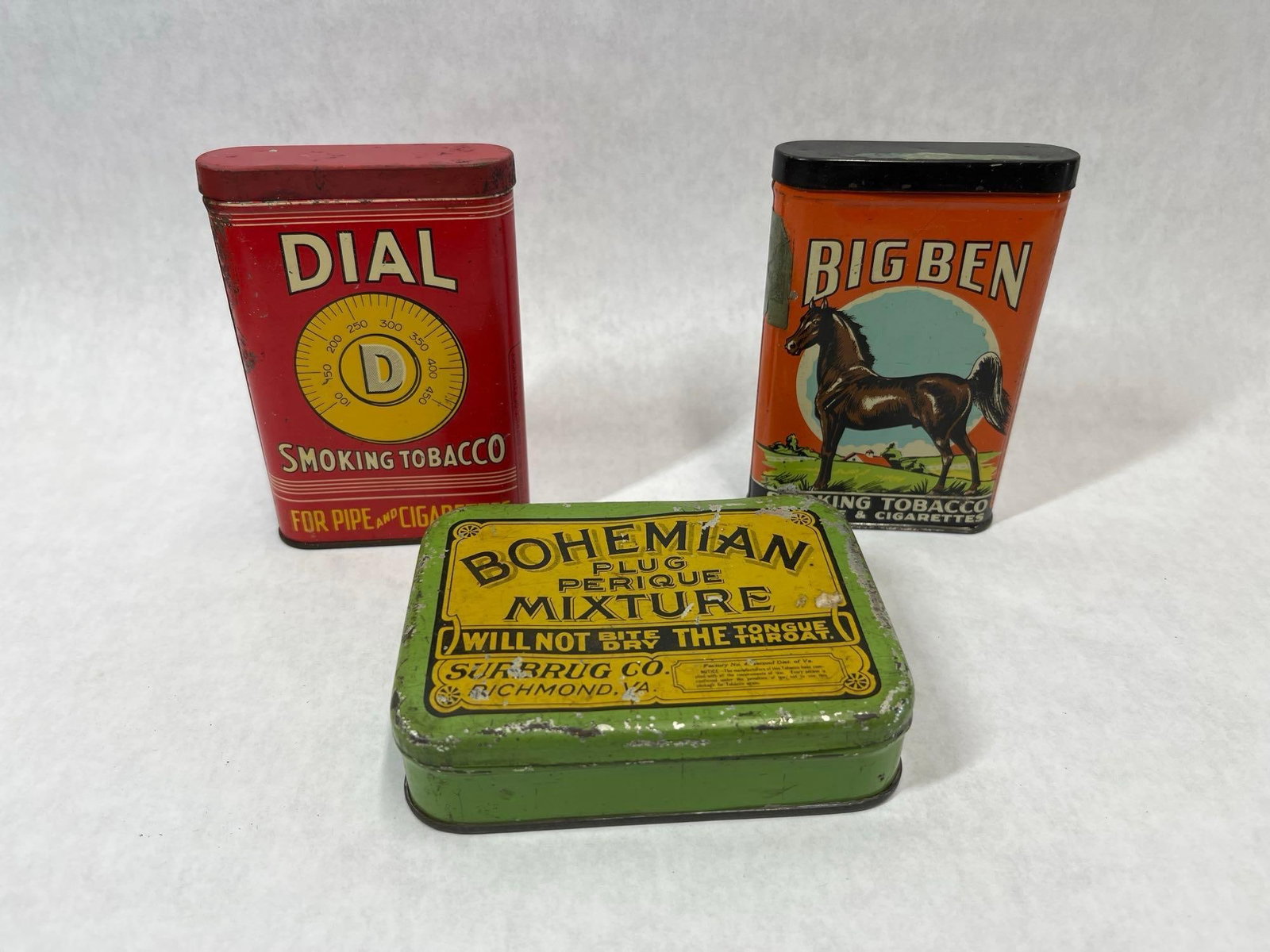 3 US Advertising Tobacco Tins, Big Ben & Dial: This lot consists of three American lithographed pocket tobacco tins dating from the early to mid-20th century. The collection includes two vertical pocket tins produced by the Brown and Williamson