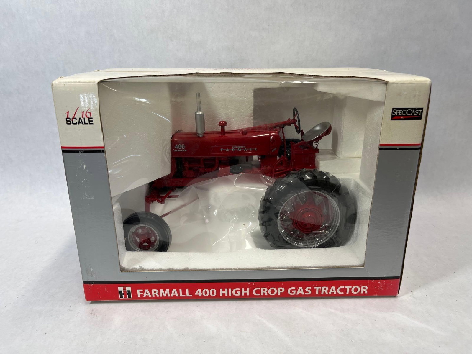 SpecCast 1/16 Farmall 400 High Crop Gas Tractor: A 1/16 scale die-cast metal replica of an International Harvester McCormick Farmall 400 High Crop gas tractor. This model was produced by SpecCast as part of their Classic Series and was released as a