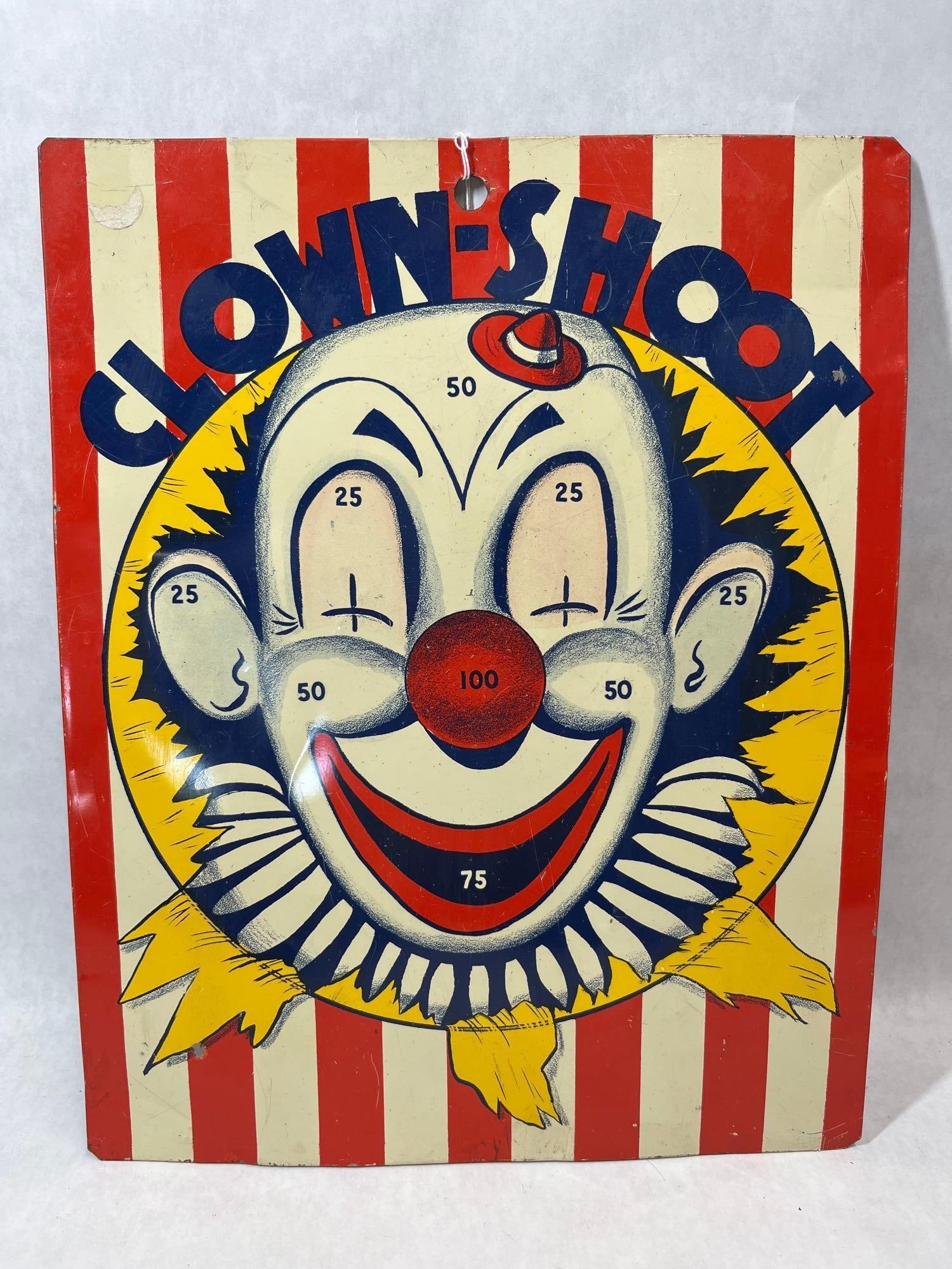 Double-Sided Clown Shoot & Dart-Base-Ball Board: A double-sided lithographed tin target game board. One side is titled Clown-Shoot and features a colorful clown face design with target zones marked with point values of 25, 50, 75, and a central