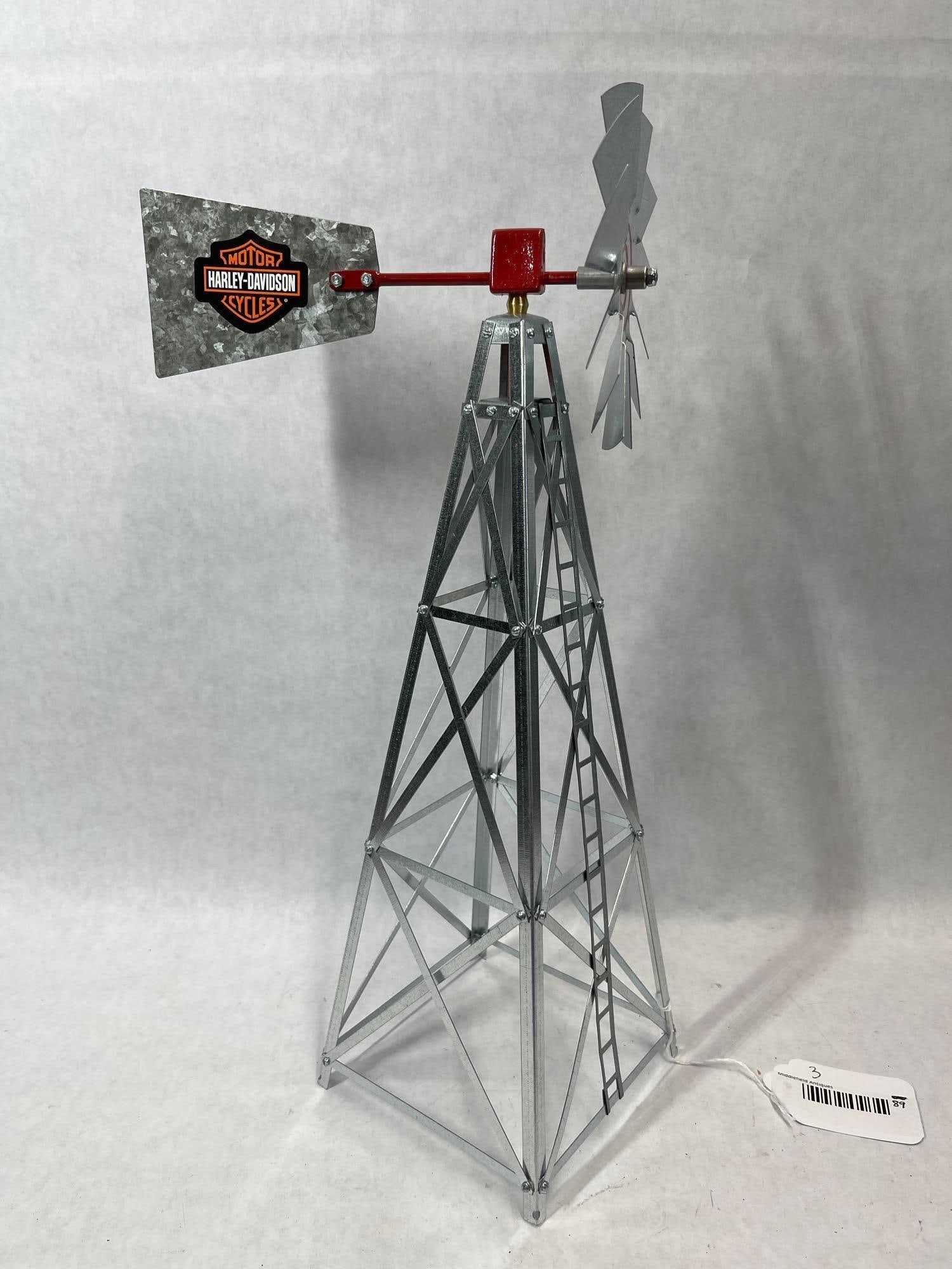 Harley-Davidson Galvanized Metal Windmill Model: This decorative tabletop model depicts a traditional American farm windmill. The structure features a four-sided, open-lattice tower built from galvanized metal with horizontal and diagonal