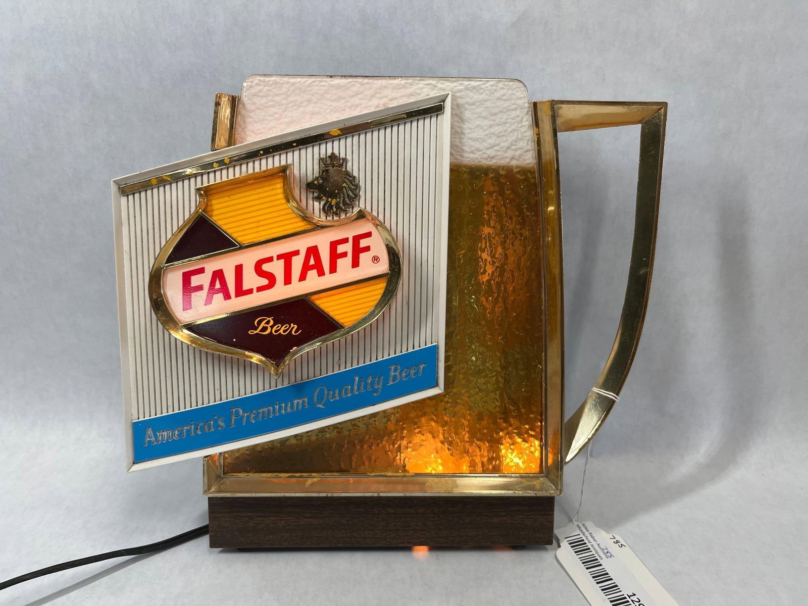 Falstaff Price Brothers Bubbling Lighted Mug Sign: This lighted bubbler beer sign was manufactured by Price Brothers, Inc. for the Falstaff Brewing Corporation. Designed in the form of a stylized pitcher or mug, the sign features a three-dimensional