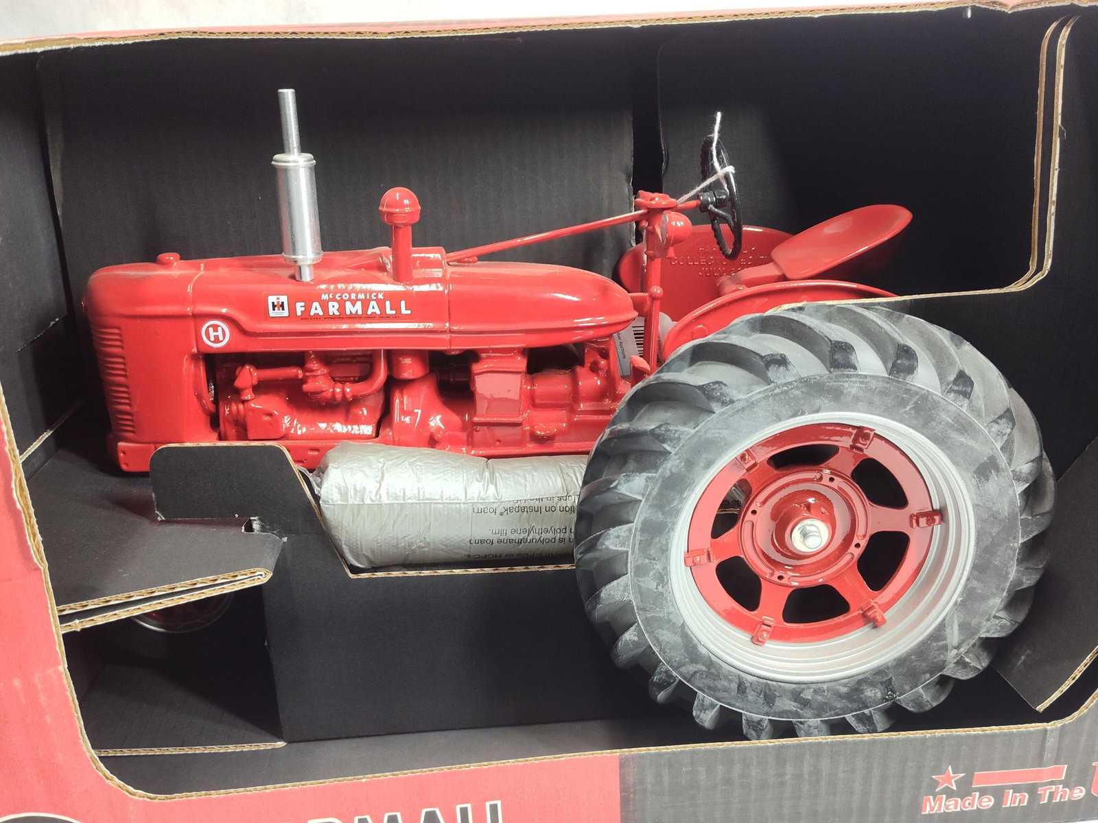 Scale Models 1/8 Scale McCormick Farmall H Tractor: A 1/8 scale McCormick Farmall H tractor manufactured by Scale Models, a division of Joseph L. Ertl, Inc., of Dyersville, Iowa. The model is constructed of die-cast metal with plastic components,