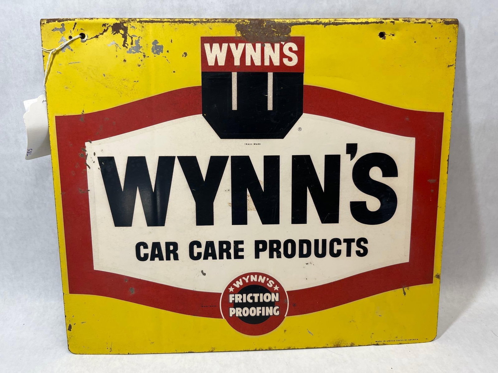 Wynn's Car Care Single Sided Advertising Rack Sign: An original mid-century single-sided advertising sign for Wynn's Car Care Products, designed as a point-of-sale display rack topper. The sign is constructed from lithographed metal featuring a bright