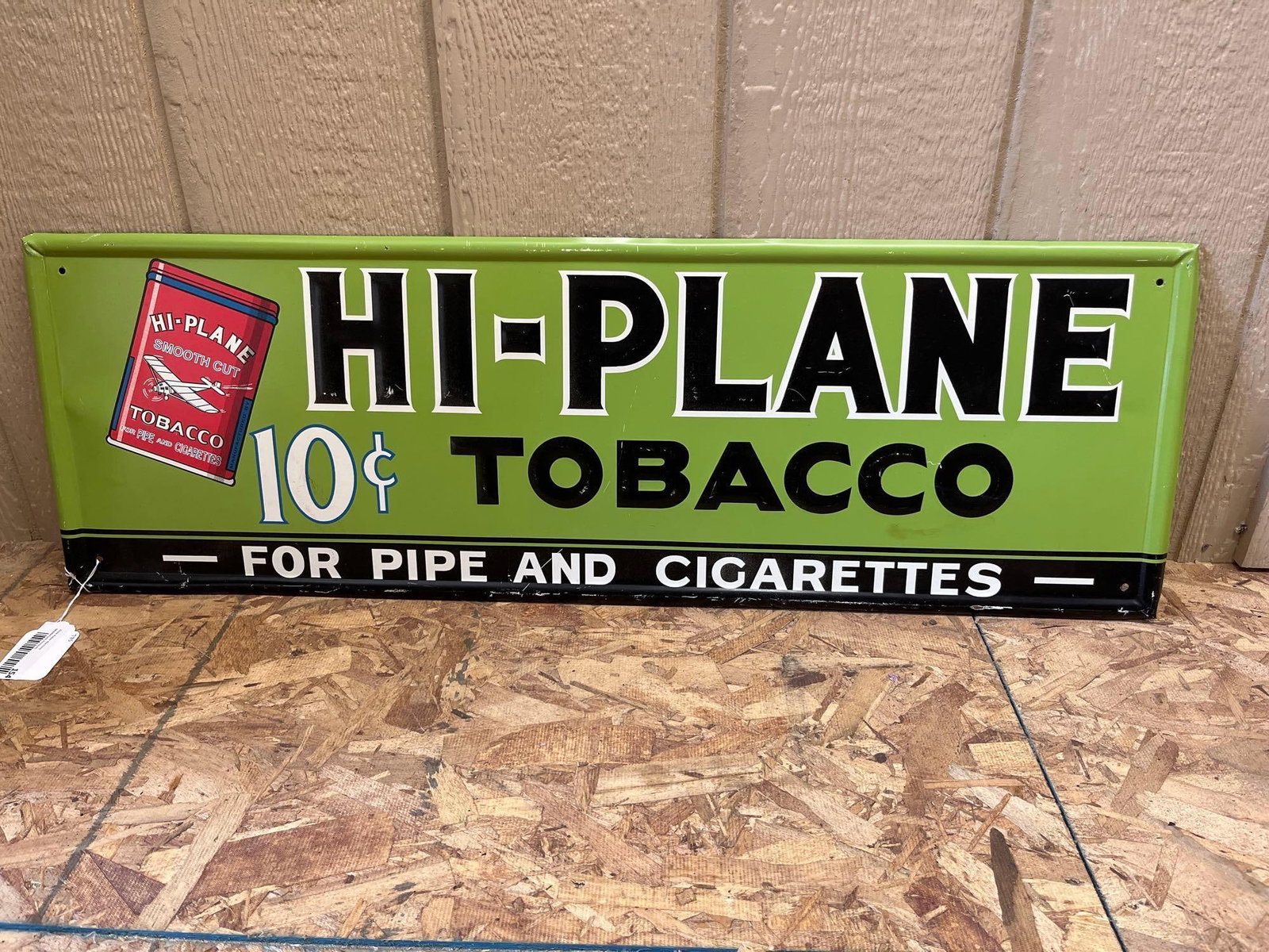 Hi-Plane Tobacco 10 Cent Embossed Tin Sign: This is an original single-sided embossed tin advertising sign for Hi-Plane Tobacco, manufactured for the Scotten, Dillon Company of Detroit, Michigan. The sign features a lime green background with