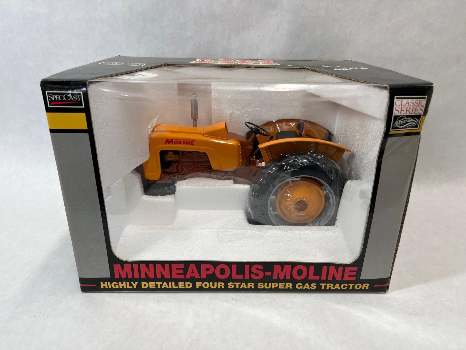 SpecCast Minneapolis-Moline Four Star Gas Tractor: This 1/16 scale replica of a Minneapolis-Moline Four Star Super Gas tractor is produced by SpecCast as part of their Classic Series. The model is manufactured from die-cast metal and includes rubber t