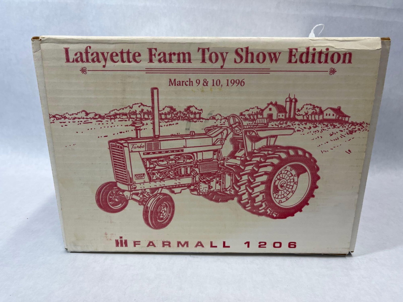 Ertl 1/16 Farmall 1206 Turbo Tractor 1996 Ltd Ed: This lot features a 1/16 scale model of an International Harvester Farmall 1206 Turbo tractor, manufactured by Ertl. This unit was produced as a limited edition for the Lafayette Farm Toy Show held on