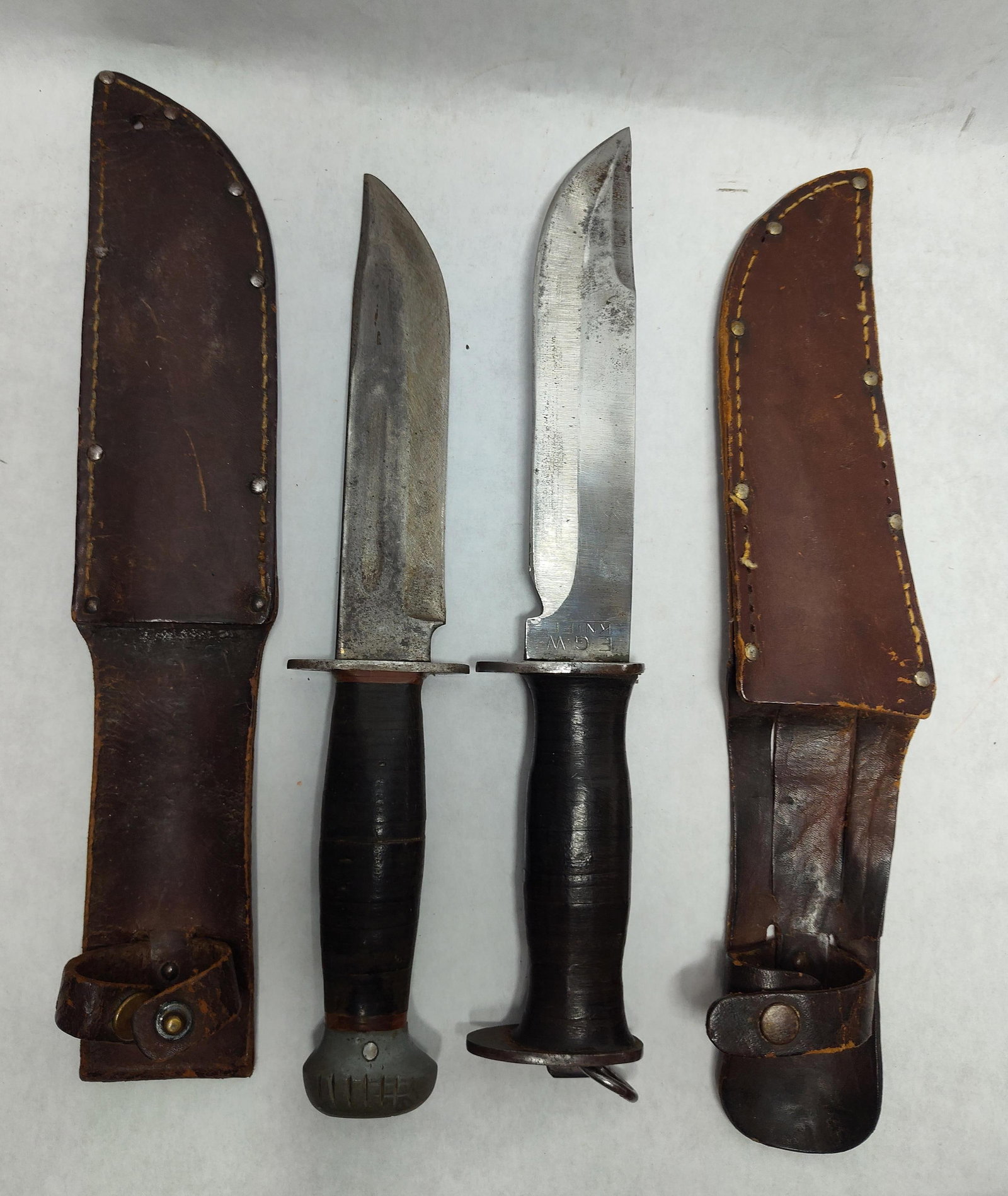 Pair WWII US Combat Knives, PAL & E.G. Waterman: This lot features two United States military-style knives from the World War II era. The first is a PAL RH-36 combat knife. The ricasso is stamped with the manufacturer mark RH, a circular PAL logo,