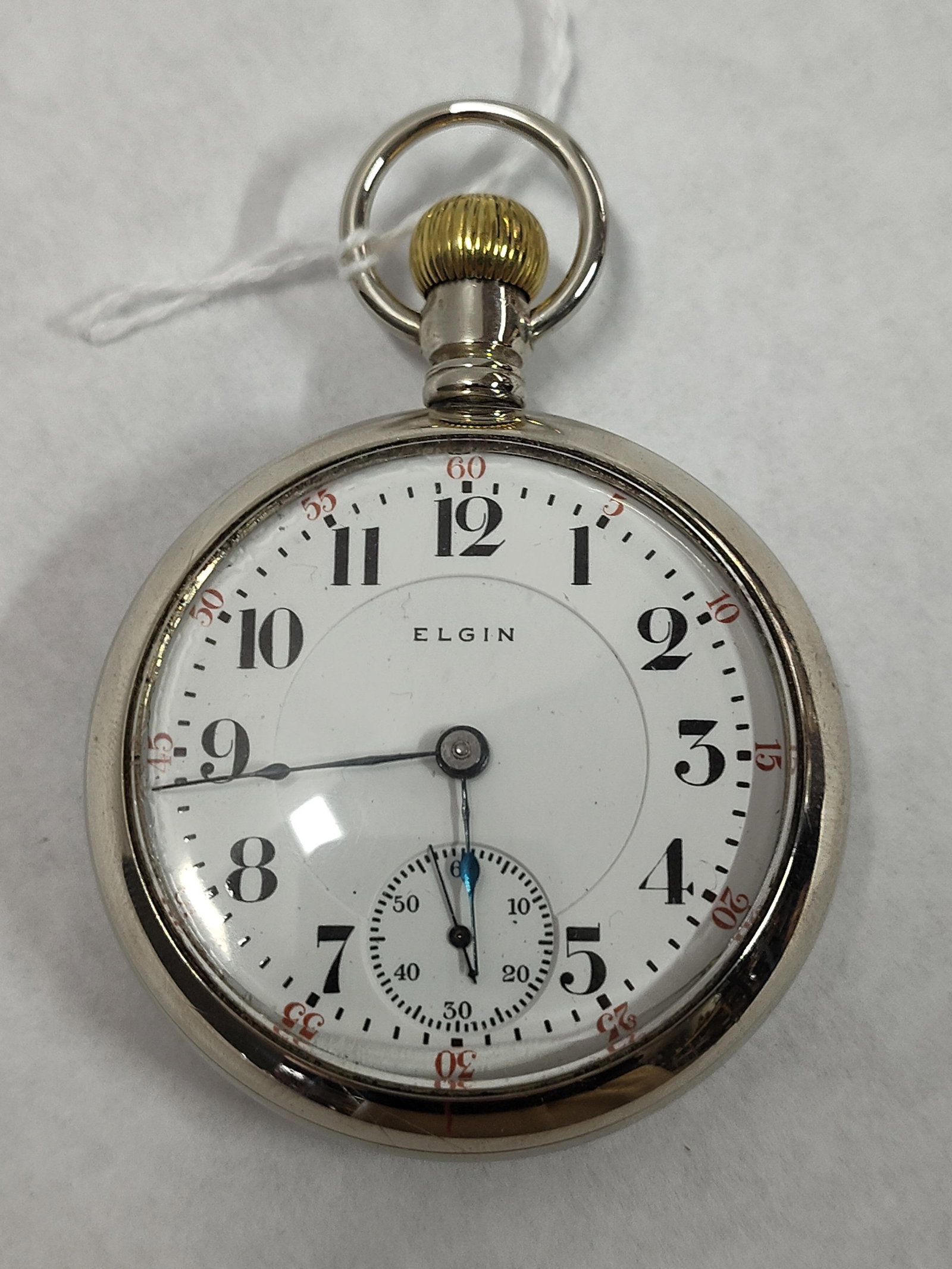 Elgin 21-Jewel Open-Face Pocket Watch, c. 1921: An open-face pocket watch manufactured by the Elgin National Watch Company. The timepiece features a manual wind, 21-jewel mechanical movement, serial number 23637851, which dates the production to ap