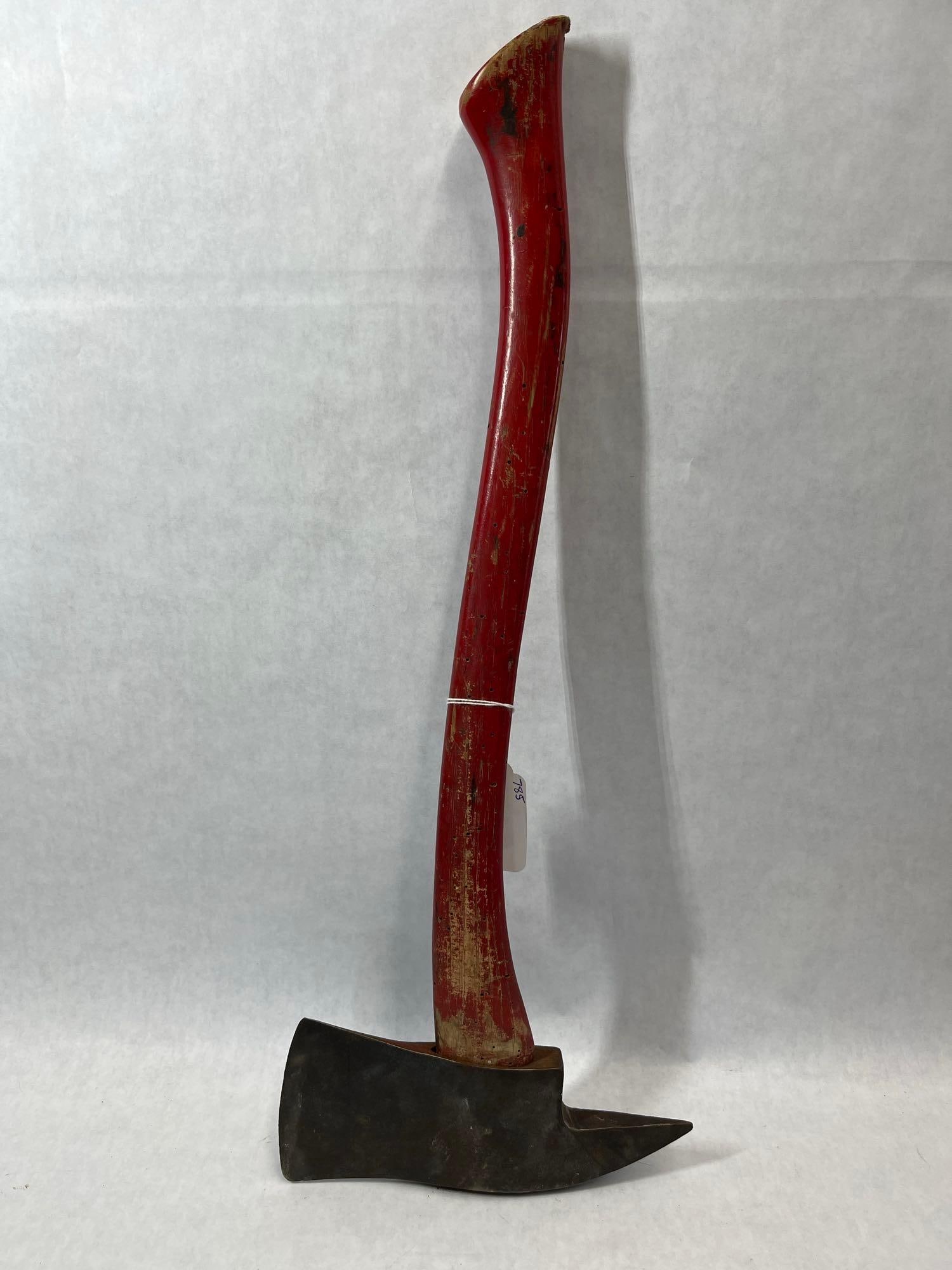 Pick-Head Fire Axe w/ Red Painted Wood Handle: Attributed to Collins based on visual characteristics and market consensus, this pick-head fire axe features a forged steel head with a broad cutting blade and a reverse pick. The head displays a